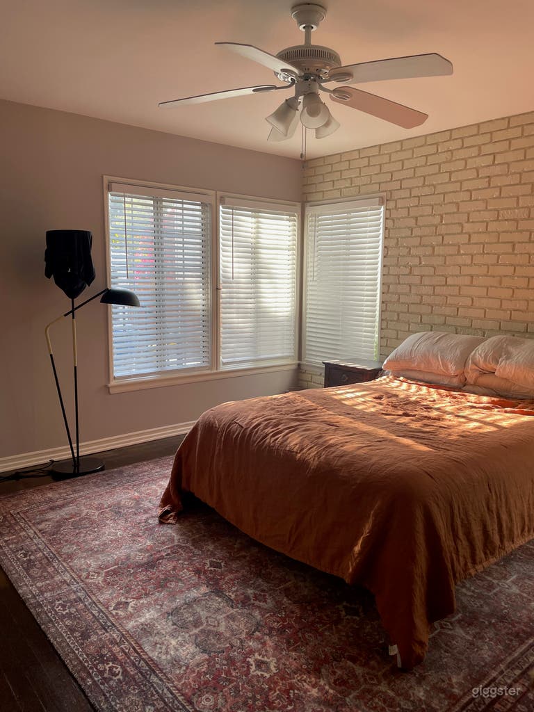  Master bedroom with a white brick wall 
