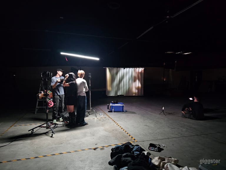  Large warehouse with lots of sets and props 