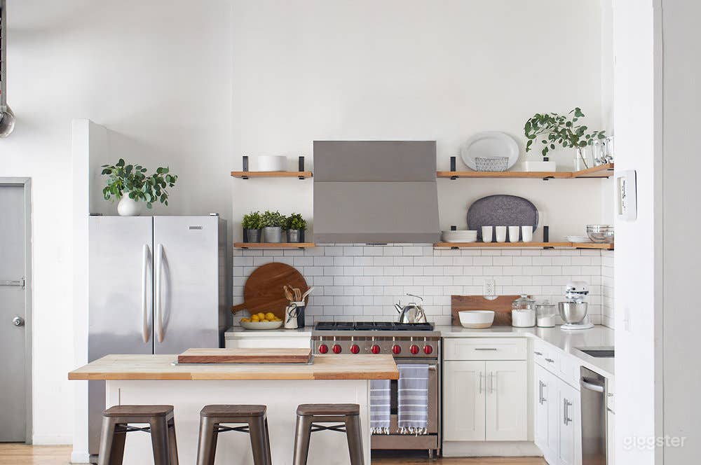Modern White Brick Kitchen Loft w/ Living &amp; Dining Area Photo 1