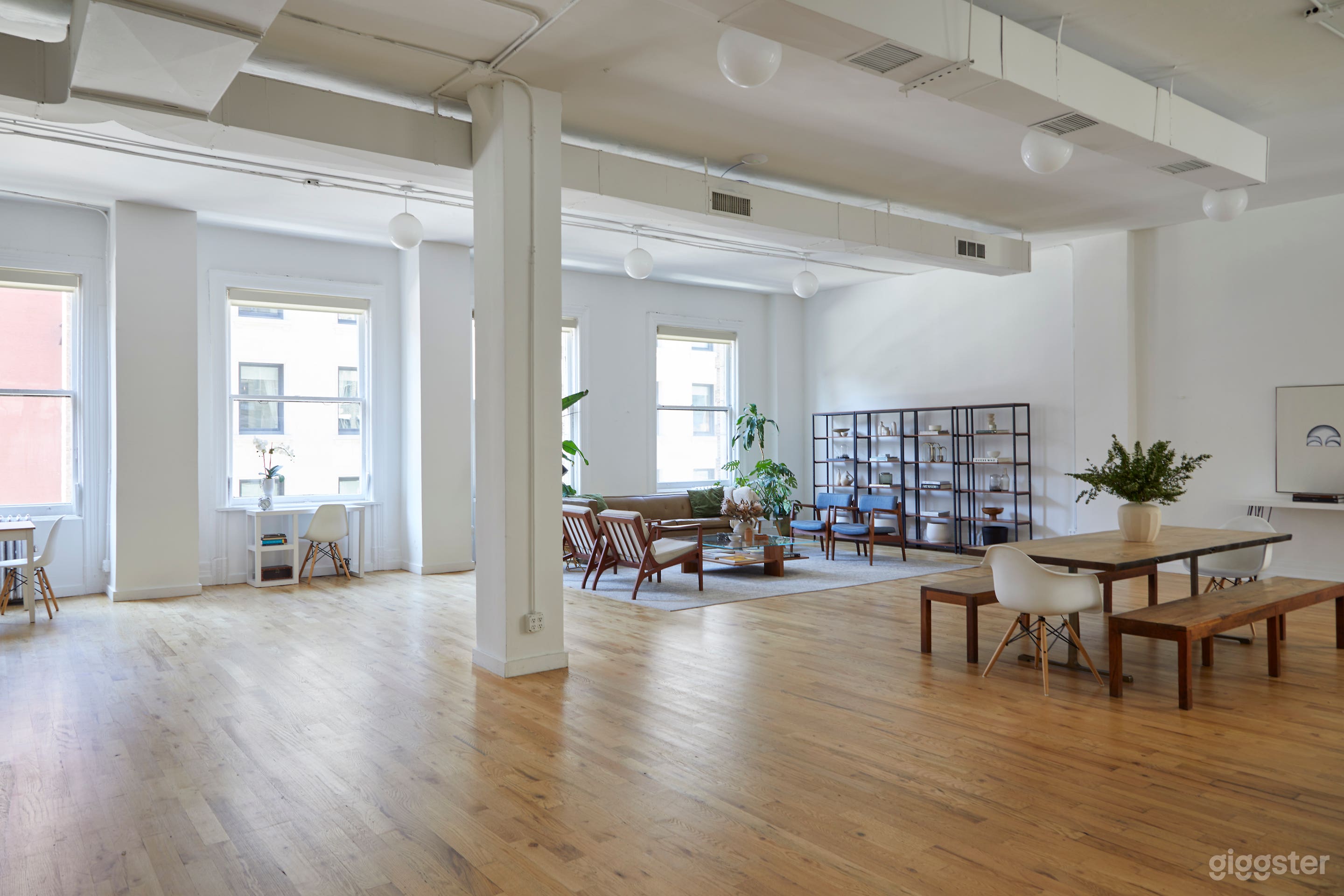 Modern White Brick Kitchen Loft w/ Living & Dining Area Photo 1