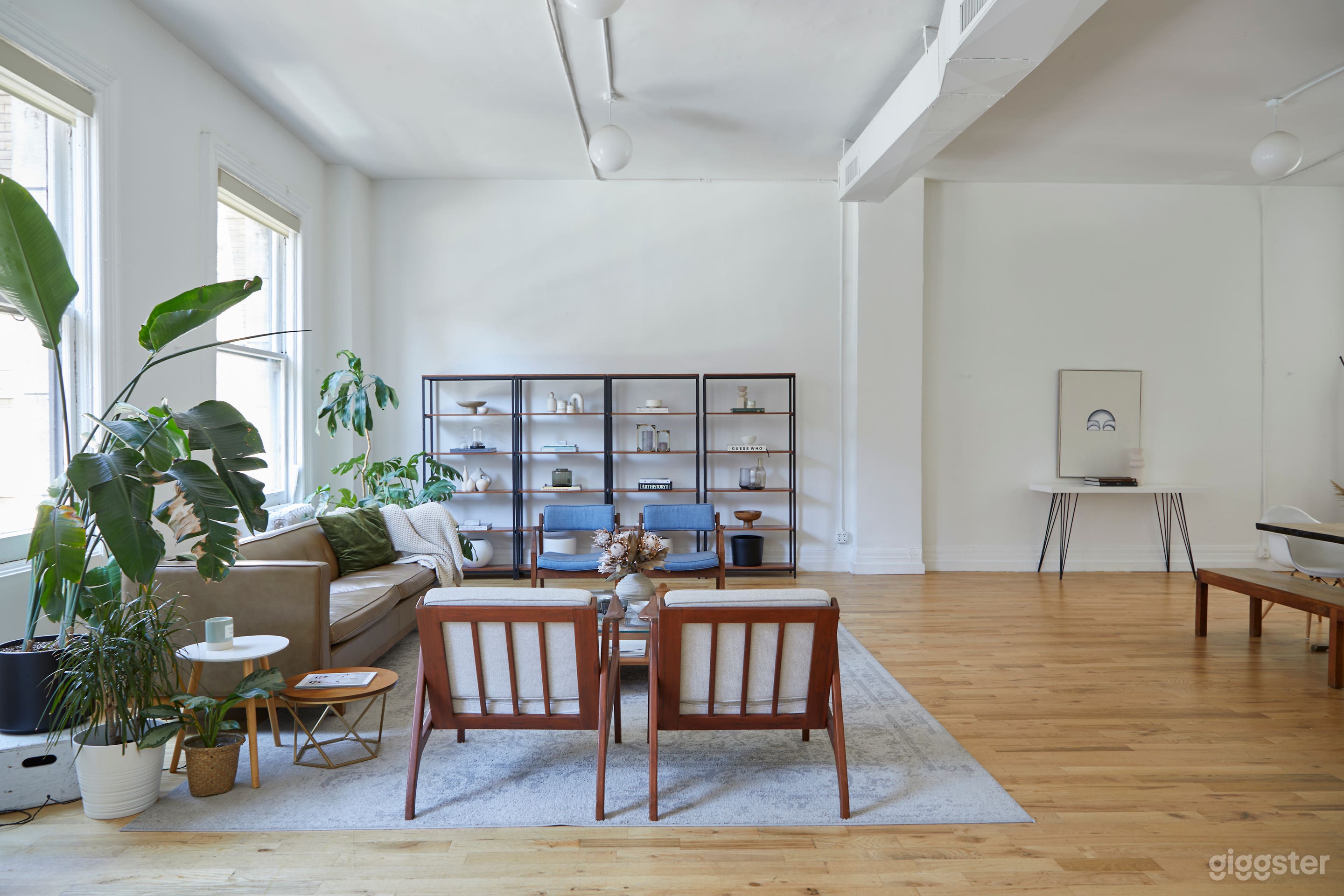 Modern White Brick Kitchen Loft w/ Living & Dining Area Photo 4