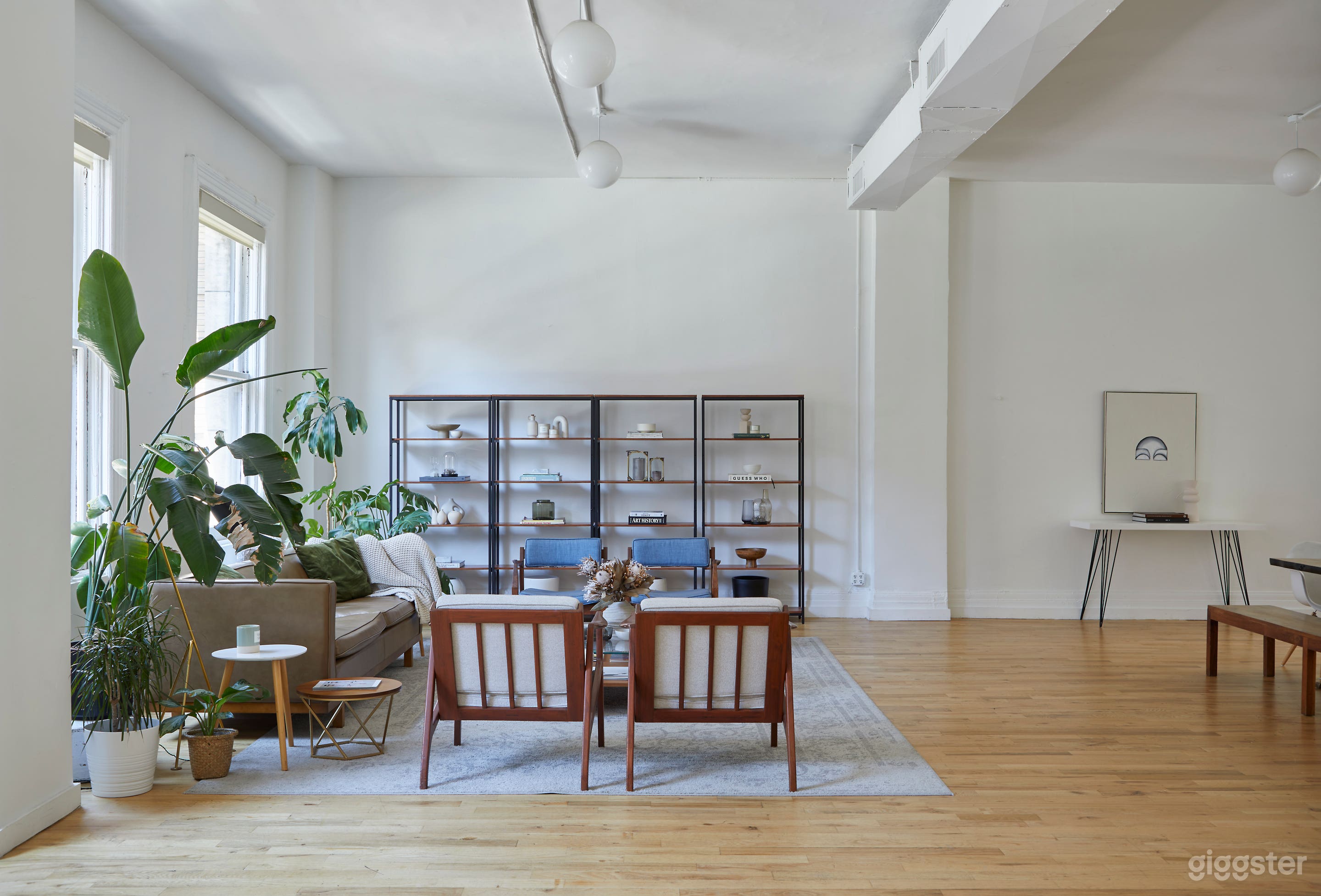 Modern White Brick Kitchen Loft w/ Living & Dining Area Photo 3