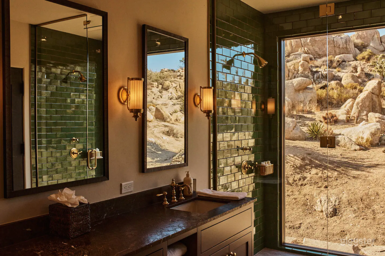  Master bathroom with floor to ceiling shower window, two shower heads, two vanities.  