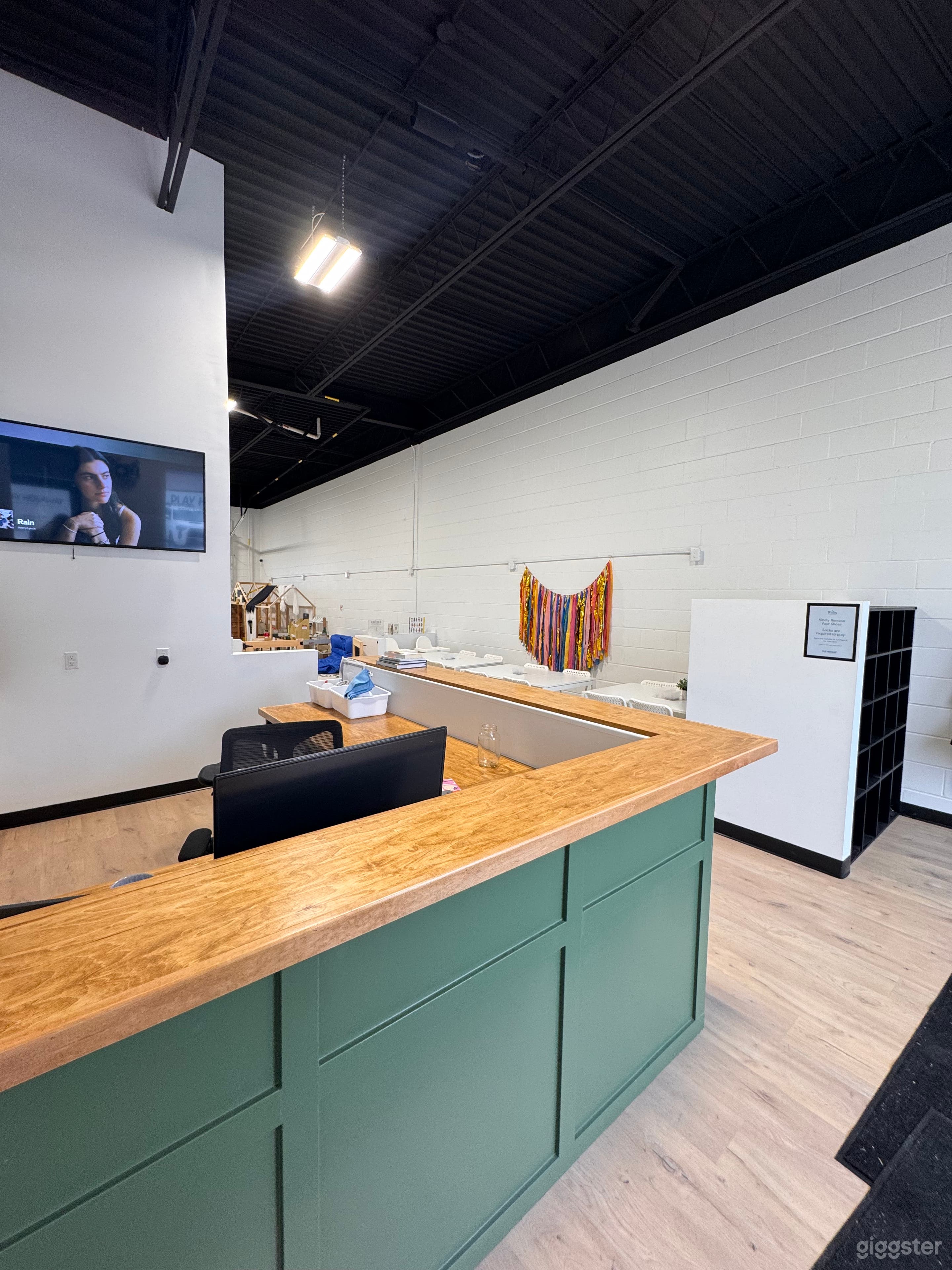 Front desk and seating area. Front desk doubles as kitchenette and small cafe. 