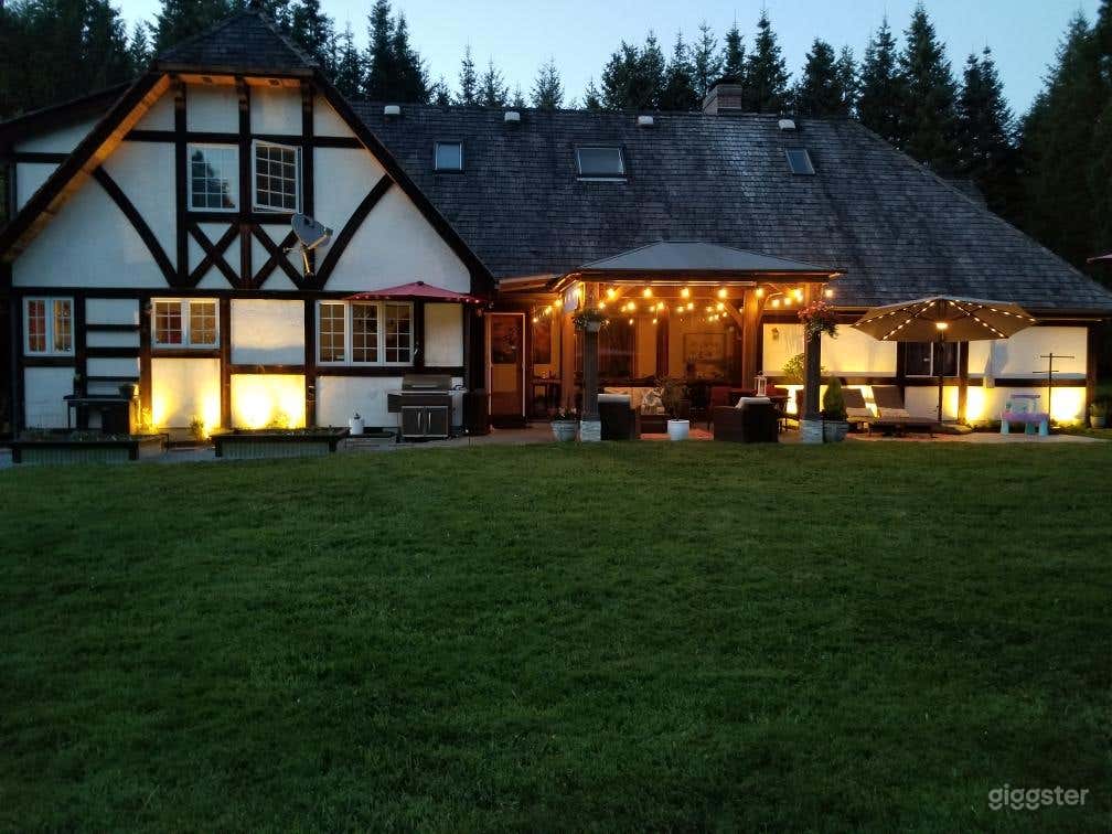 Tudor home in the woods with large pond Photo 1