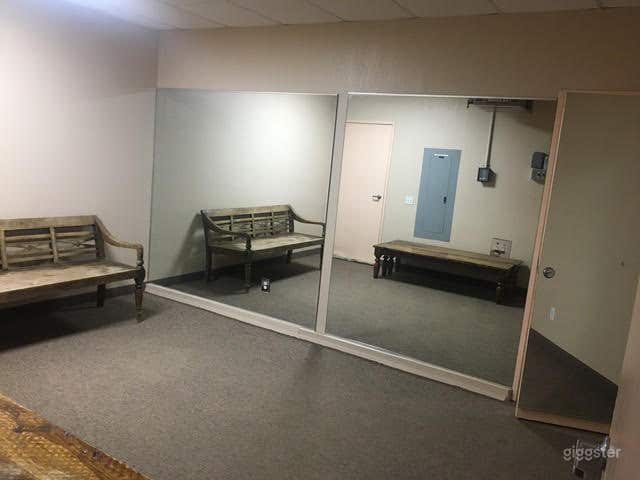  Clean, Carpeted Yoga Room with One-Mirrored Wall  