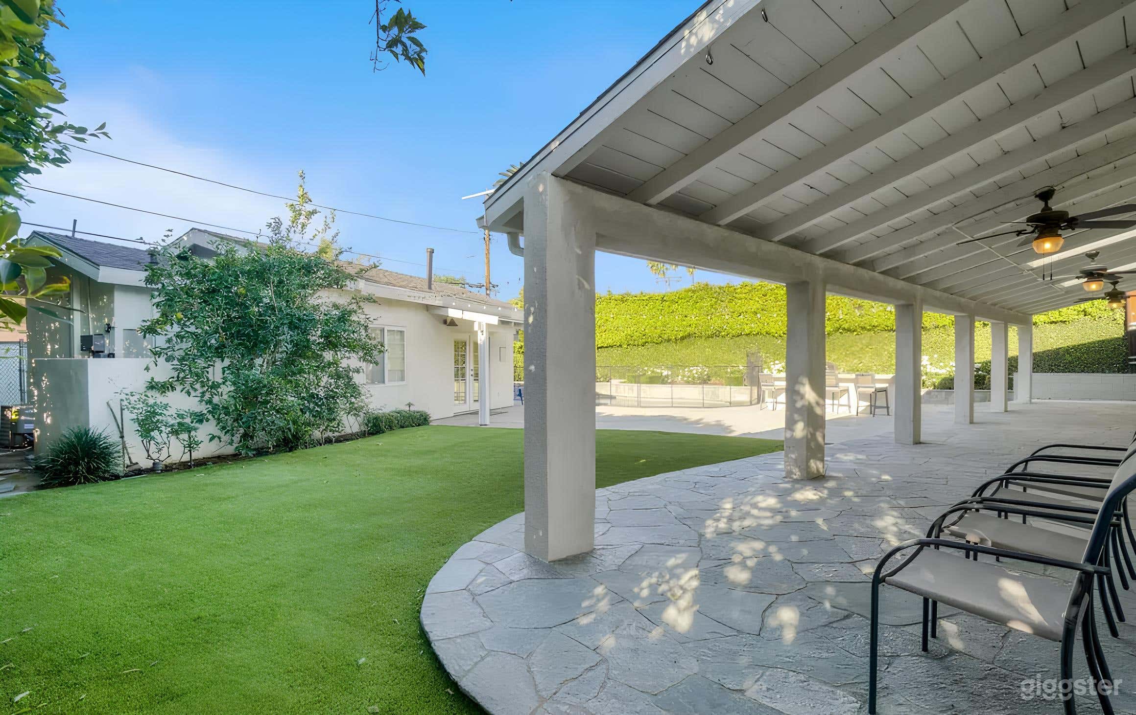 Backyard Resort-Style Setting with a Pool Photo 3