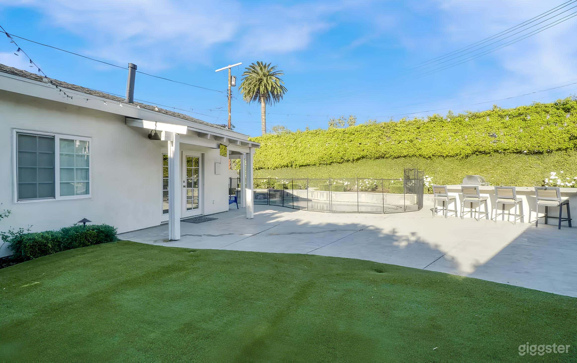 Backyard Resort-Style Setting with a Pool Photo 2