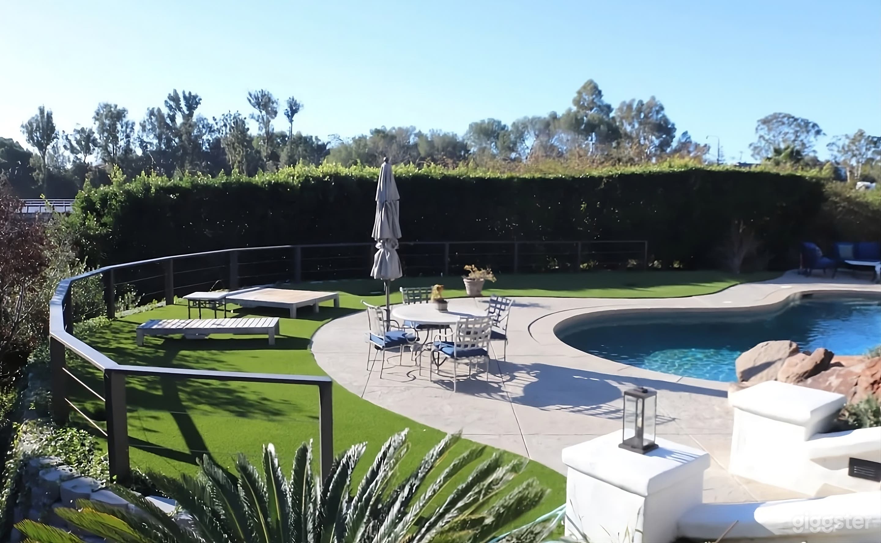 Mediterranean Style Estate Backyard with Pool Photo 3