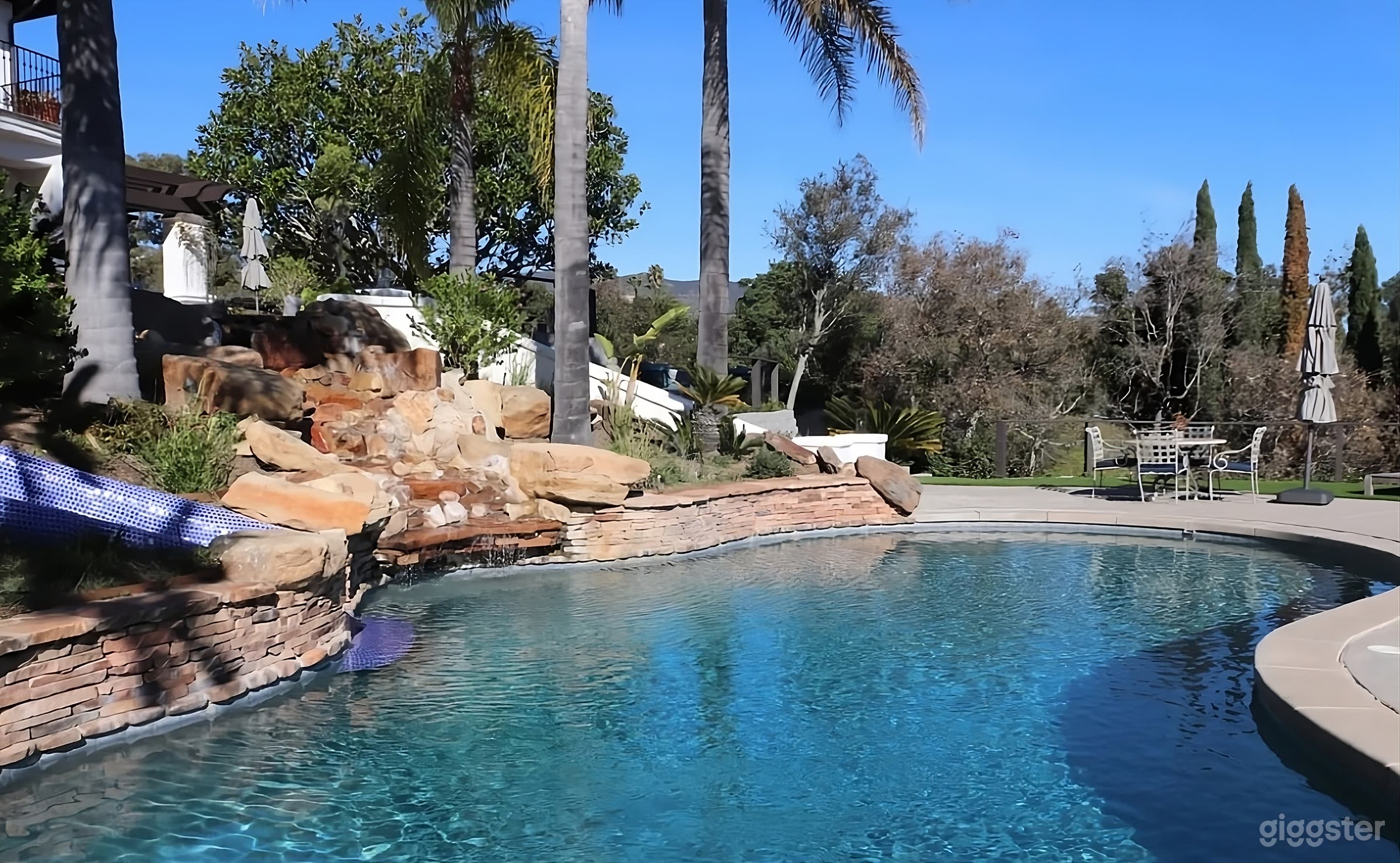 Mediterranean Style Estate Backyard with Pool Photo 4