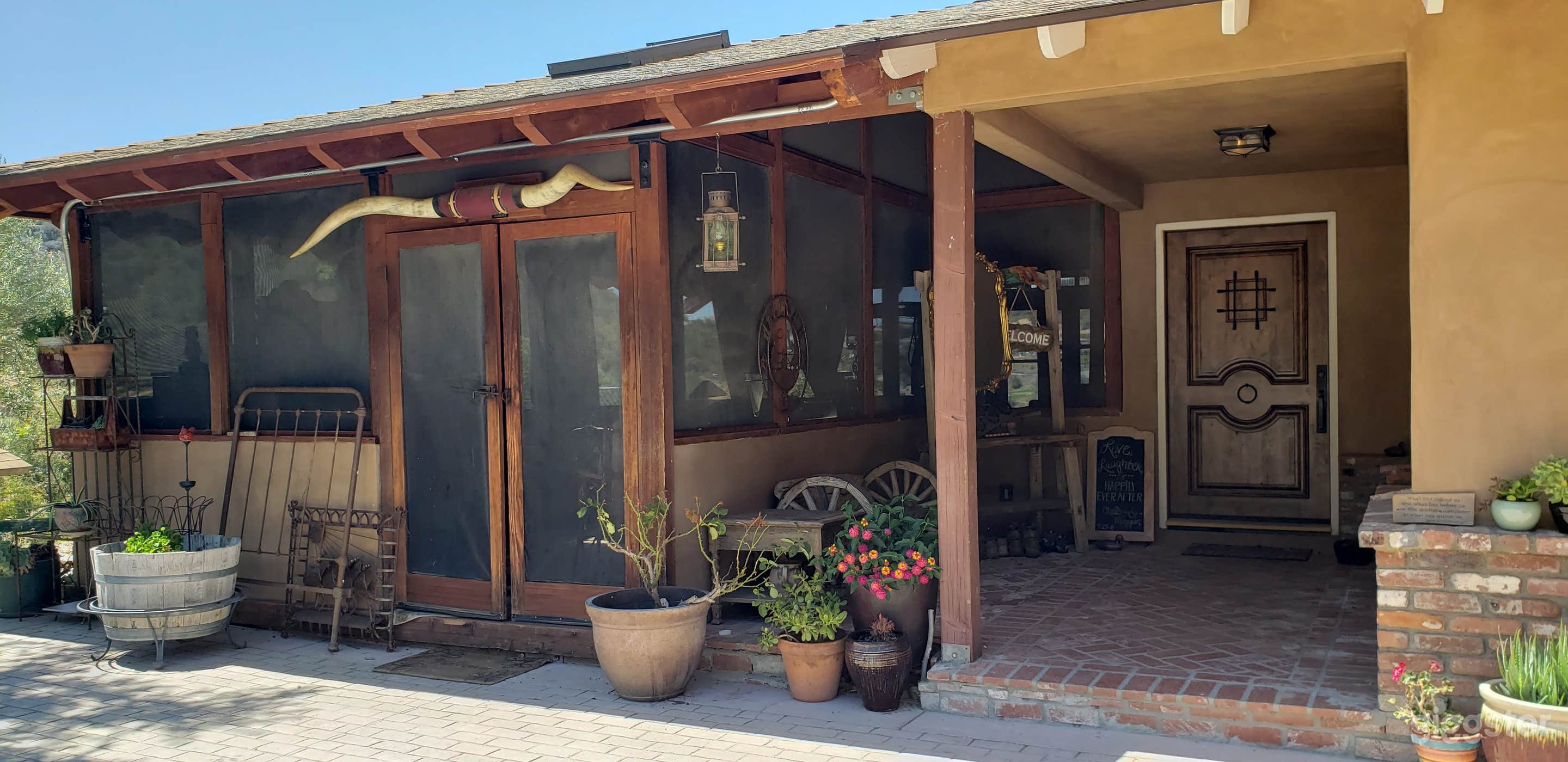 Front entrance to main house with parking area for 6 cars