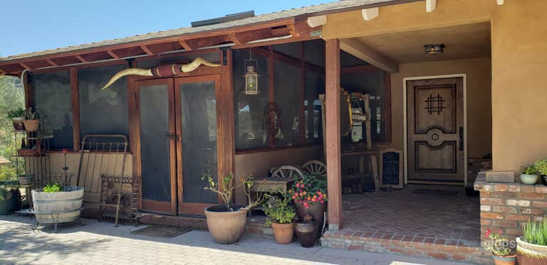  Front entrance to main house with parking area for 6 cars 