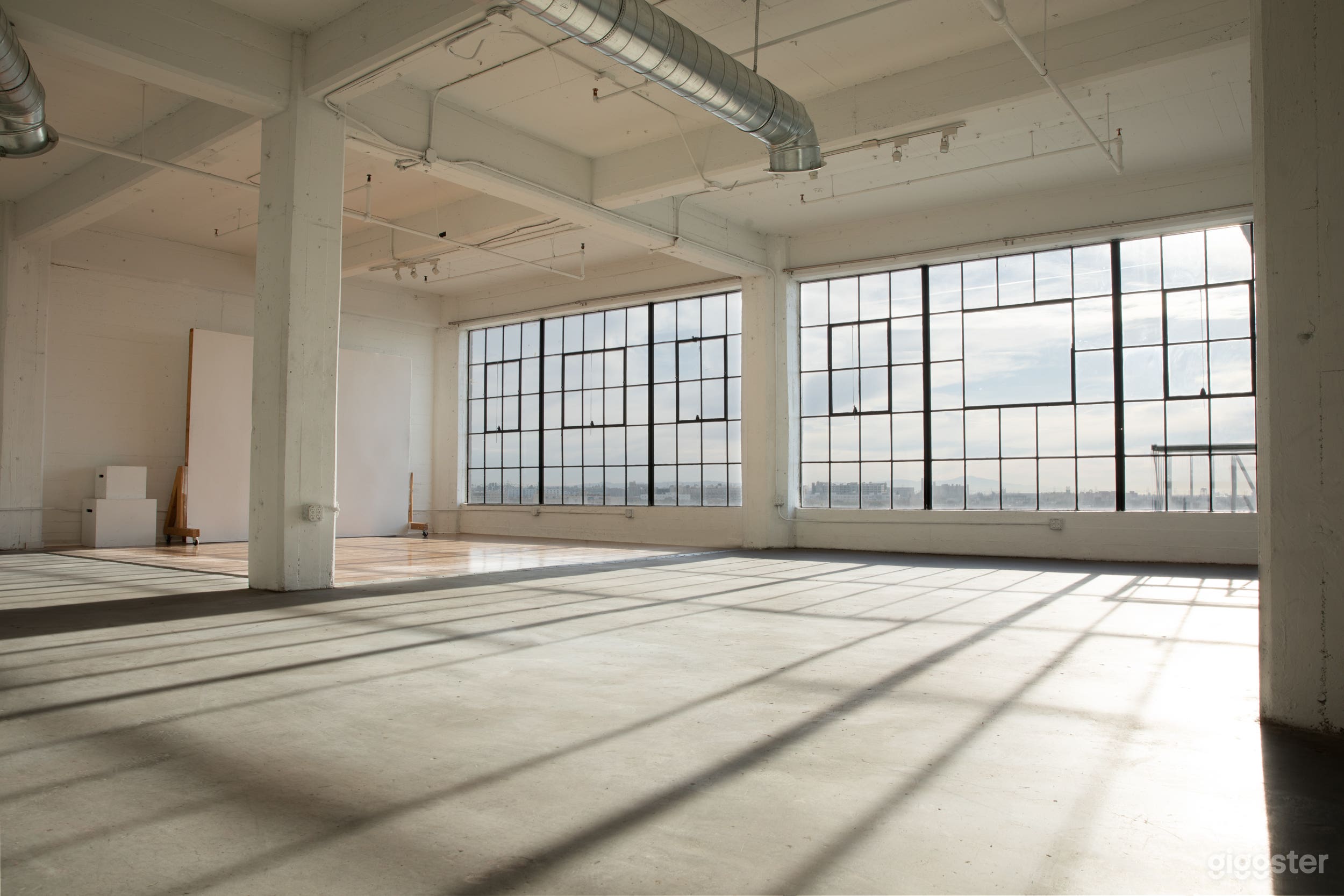 Studio F - Morning light with East facing windows.  Half of the windows have wooden floor, the other half is concrete.