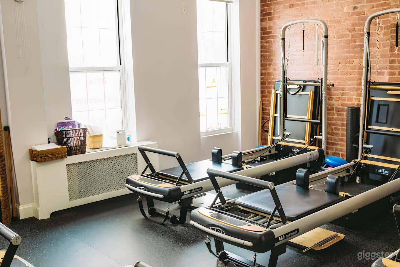 Contemporary Pilates Studio with Brick Walls Photo 1