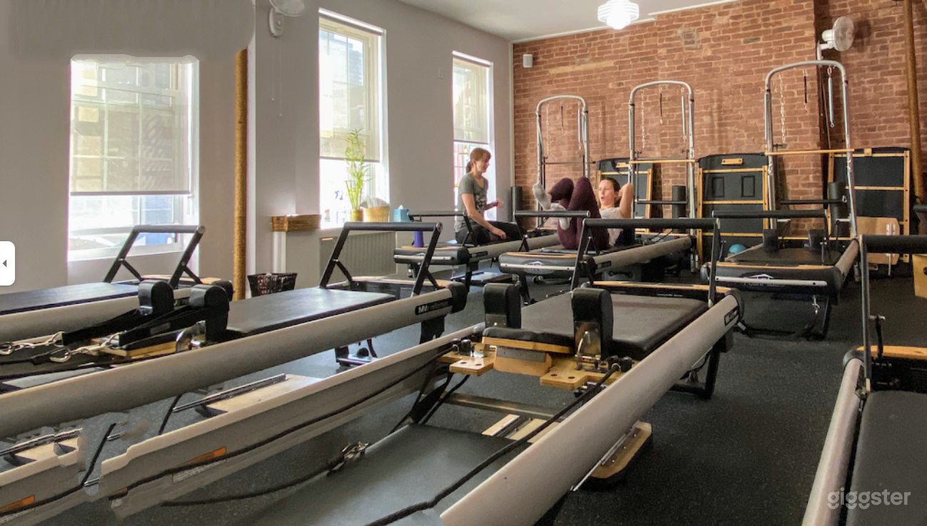 Contemporary Pilates Studio with Brick Walls Photo 2