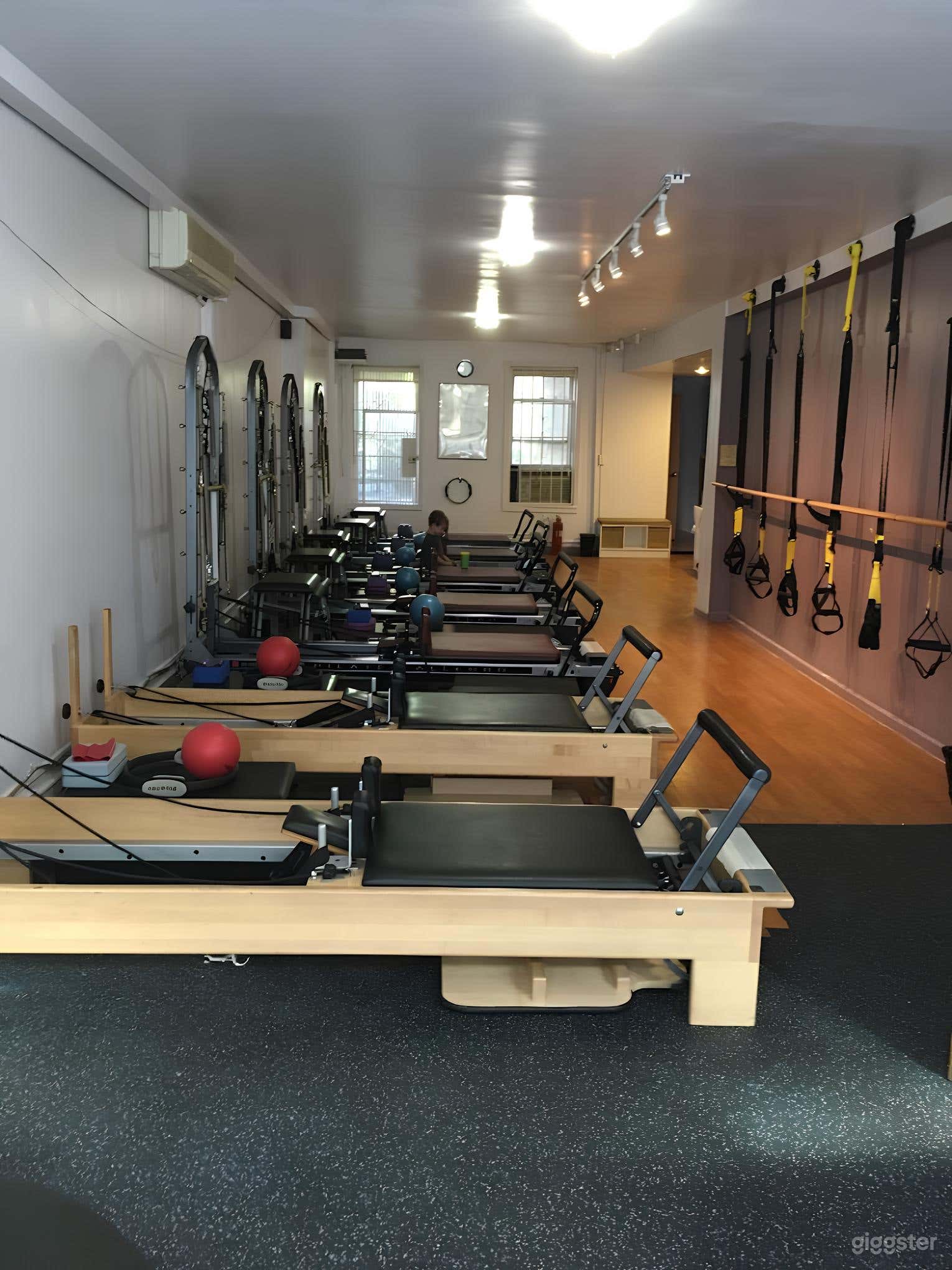 Contemporary Pilates Studio with Brick Walls Photo 3