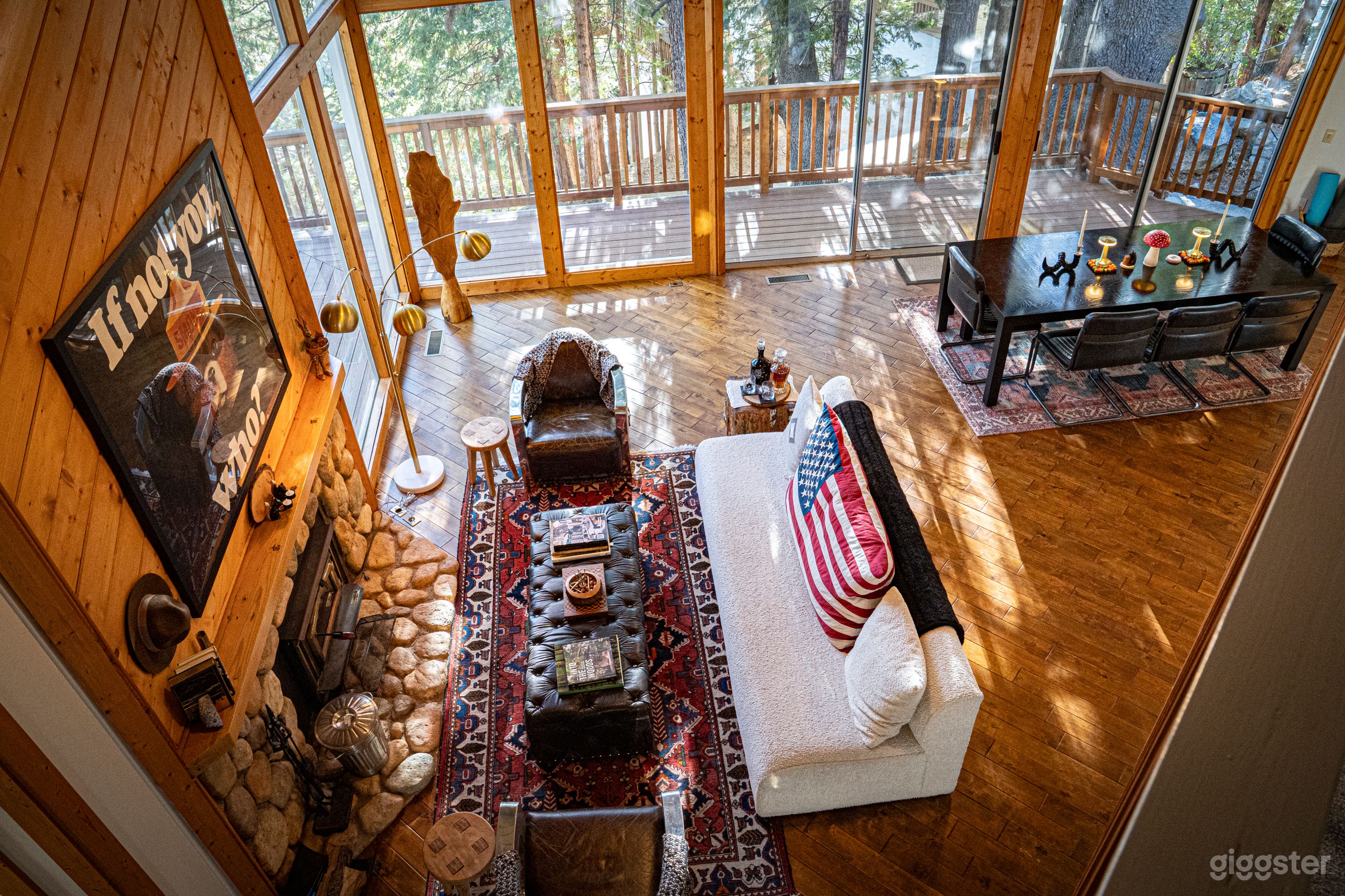 Look from the catwalk upstairs onto the living room and fireplace