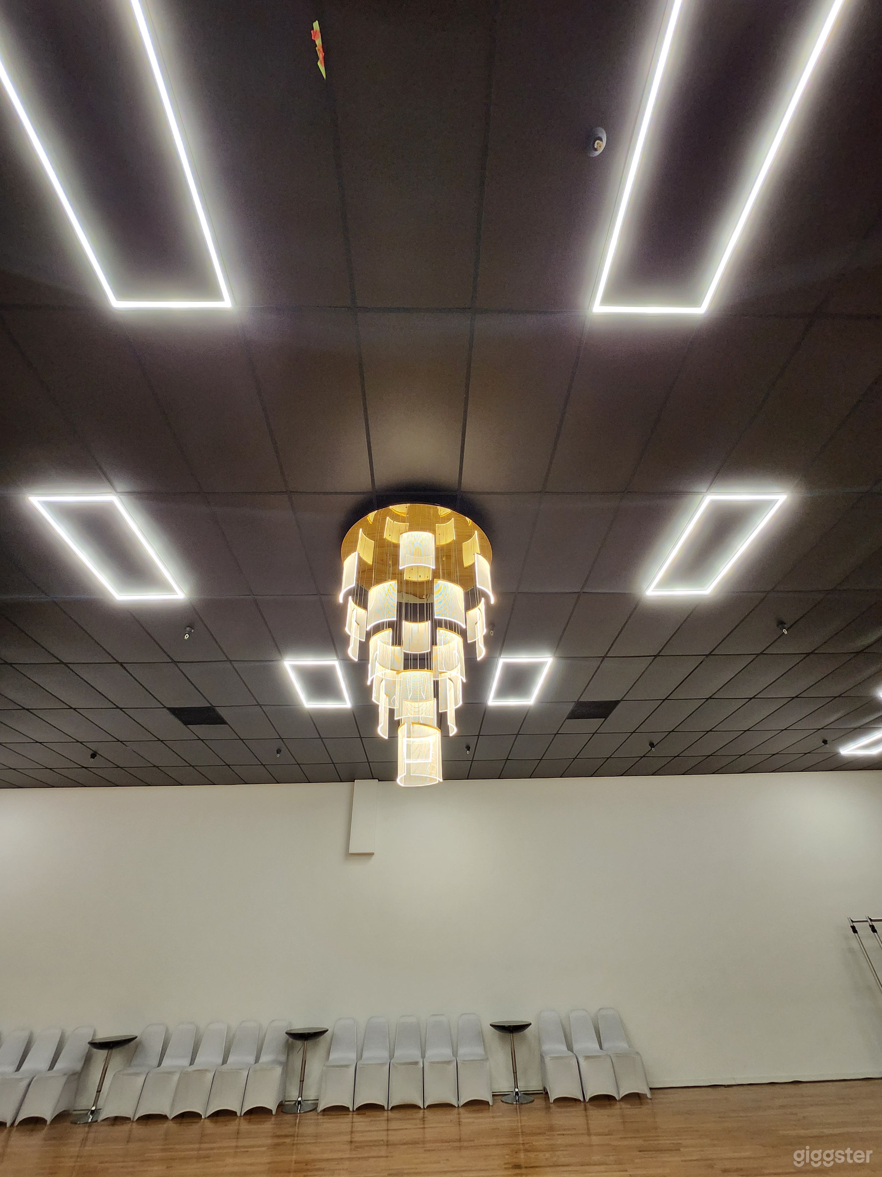 Our modern dimmable LED panel lights and 7ft tall chandelier that is also dimmable and color temperature adjustable (3000 - 5000K).