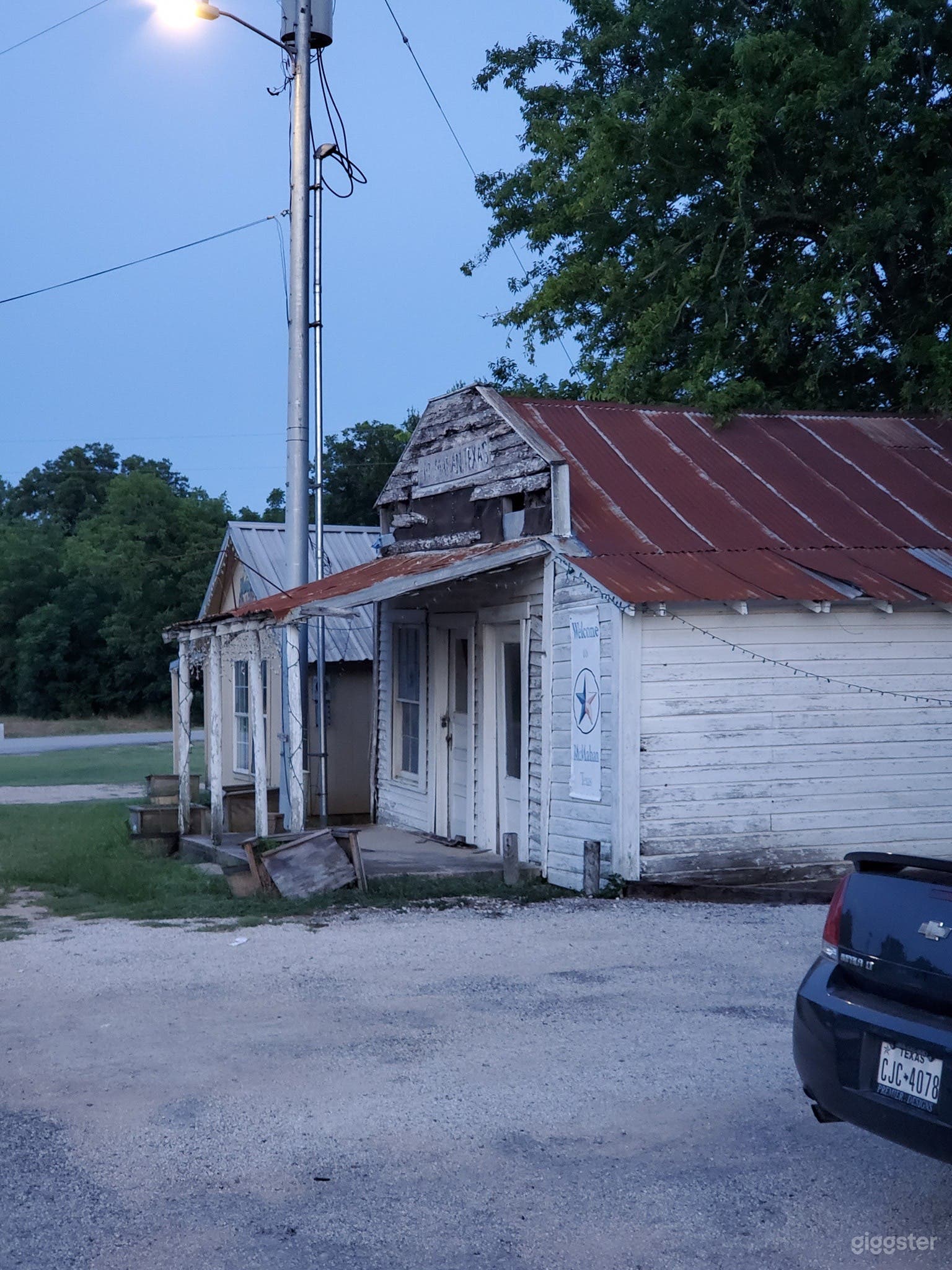 The barber shop (closest building) and small garage