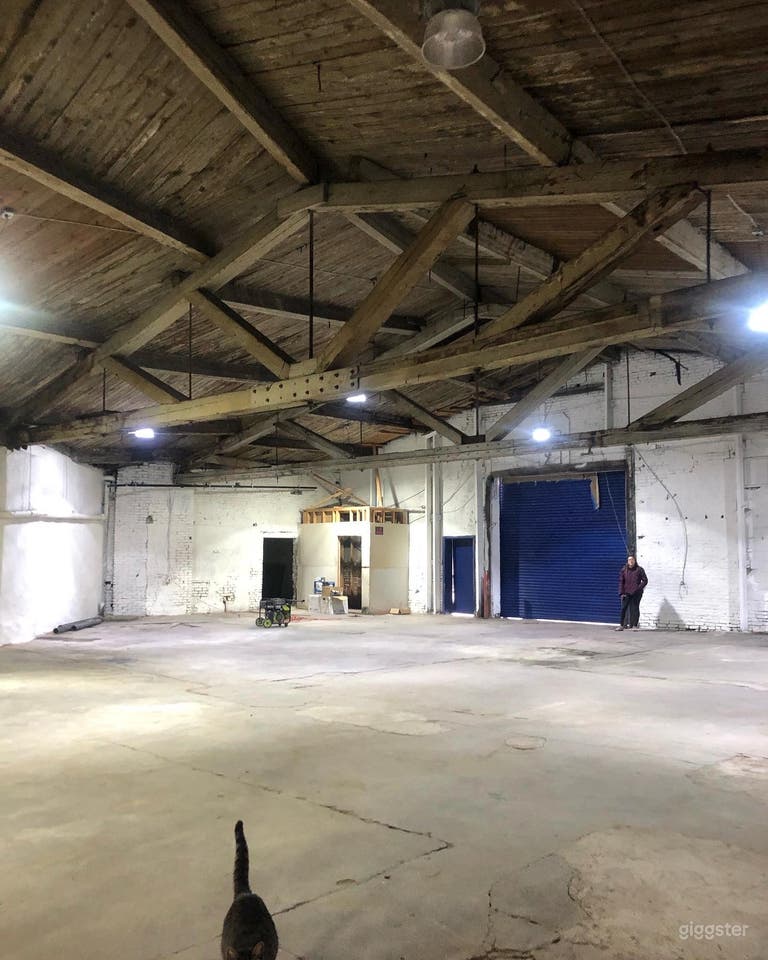  View from the back. Note the ceilings and the tall Roll up gate that can accept large trucks.  