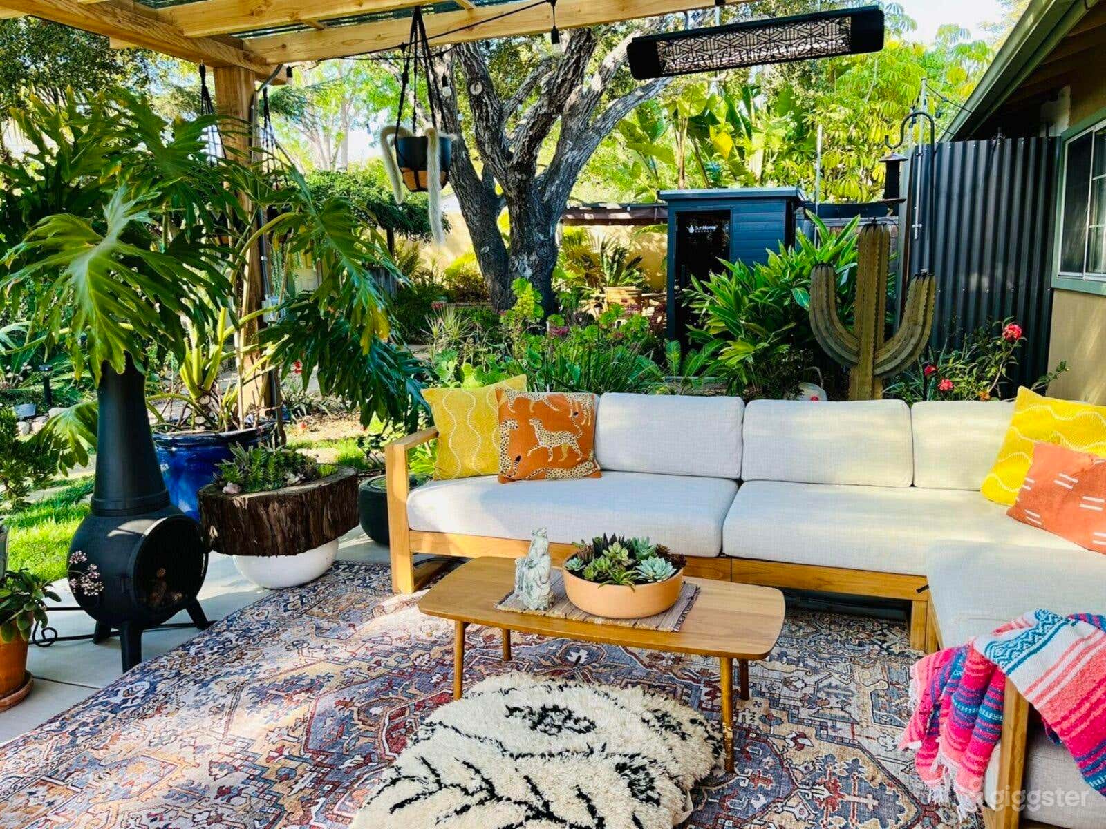Brand new lounge patio under Pergola with Chiminea. Boho-style w/ mountain views, filtered sun. Adjacent to beautiful mature landscaping &amp; Sauna.Perfect for interview-style filming, golden hour shots, intimate gatherings, wellness and lifestyle shots. 