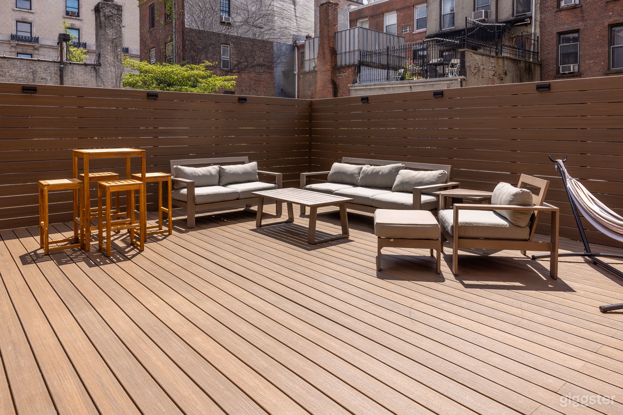 The large patio is uncovered for full sun! There is patio furniture that can be moved or removed.