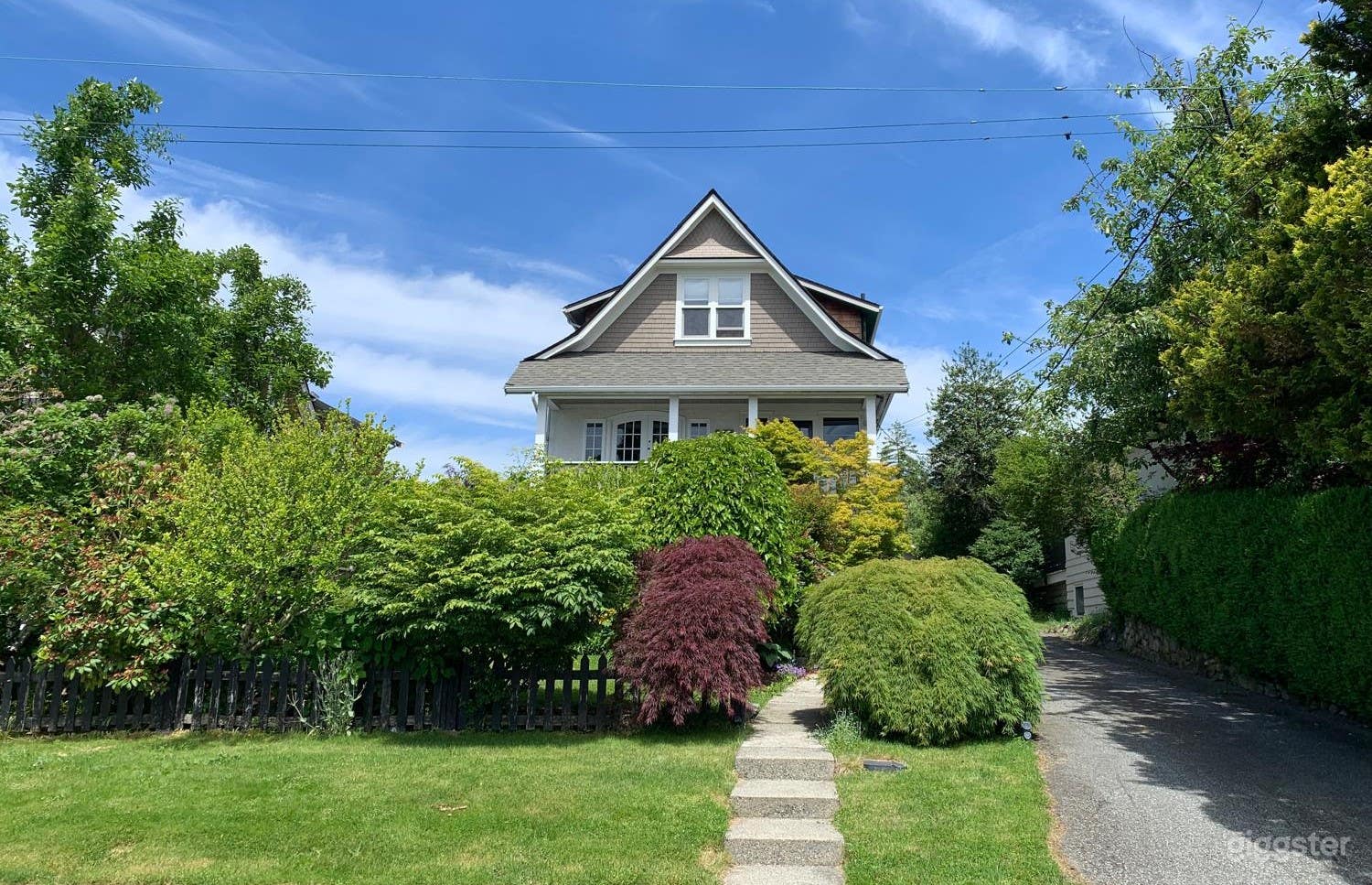 Front view with garden and driveway.