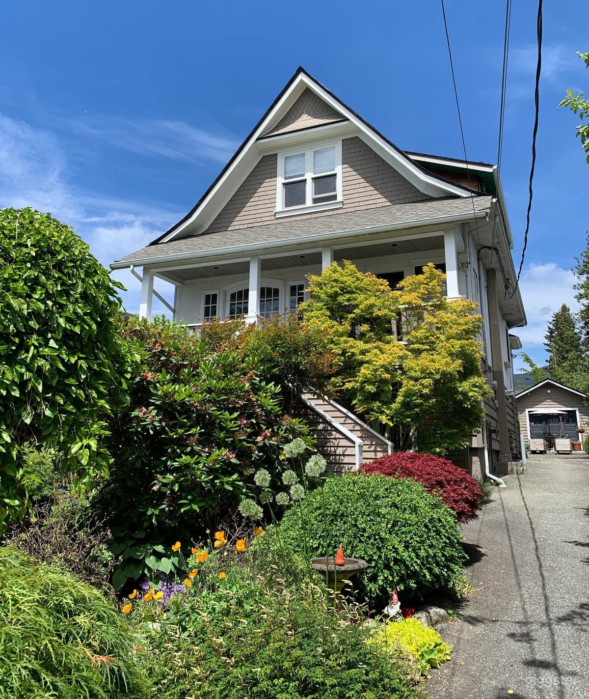 Front view facing north with driveway to the east.