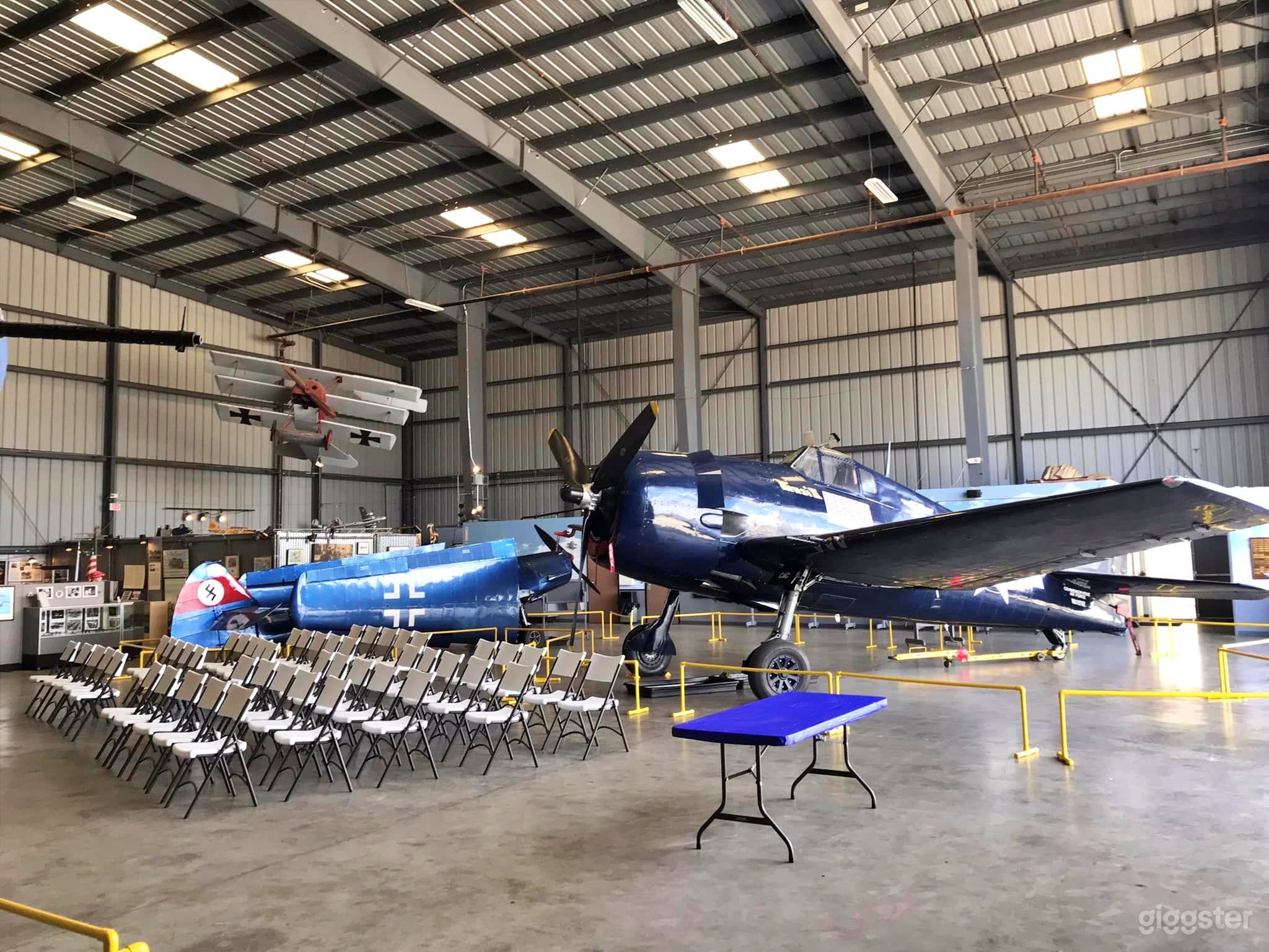 Versatile Hangar Space with Planes Photo 1