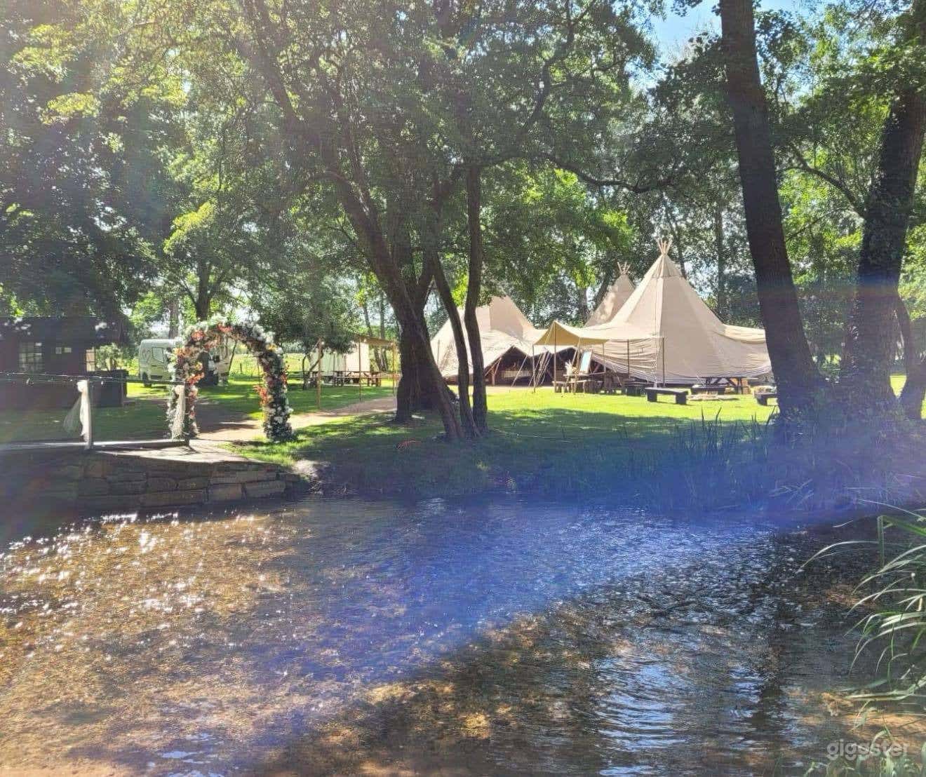 Exclusive use camping wedding venue.  Photo 1