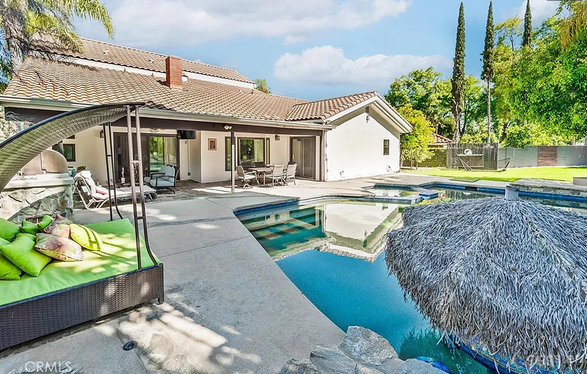 Scenic Outdoor Pool With Lush Garden Oasis Photo 3