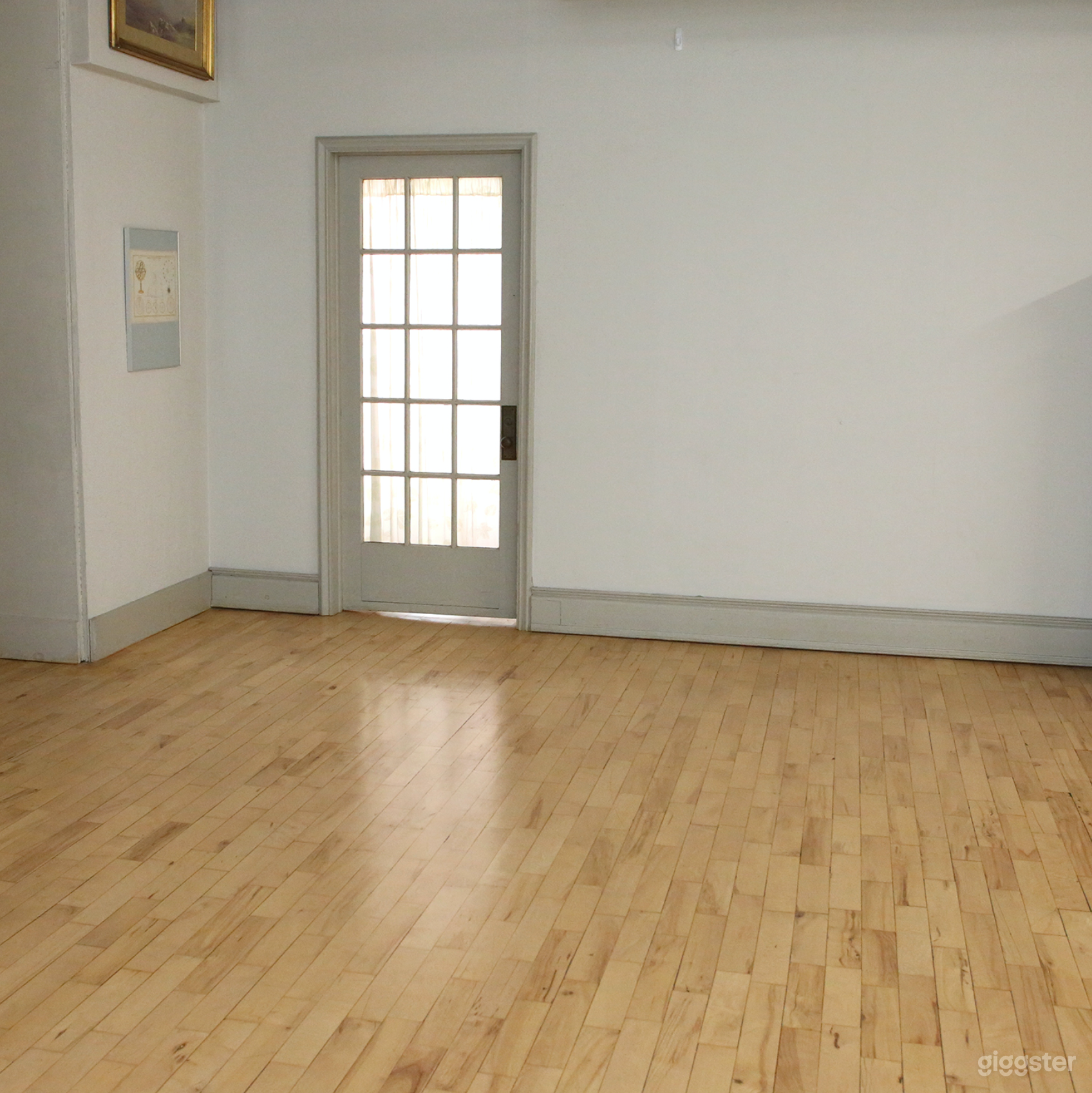 Working door in large, blank wall.