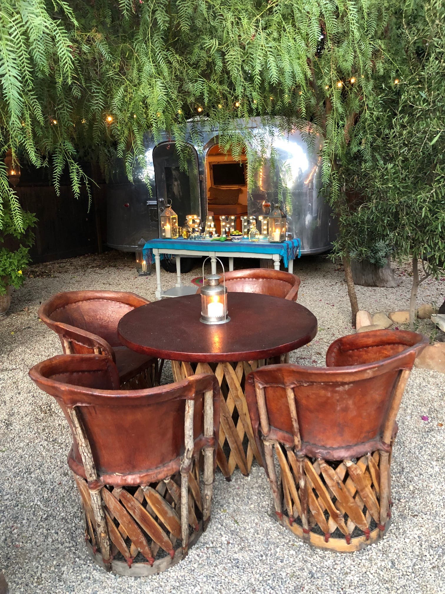 Chairs and tables, lights in trees