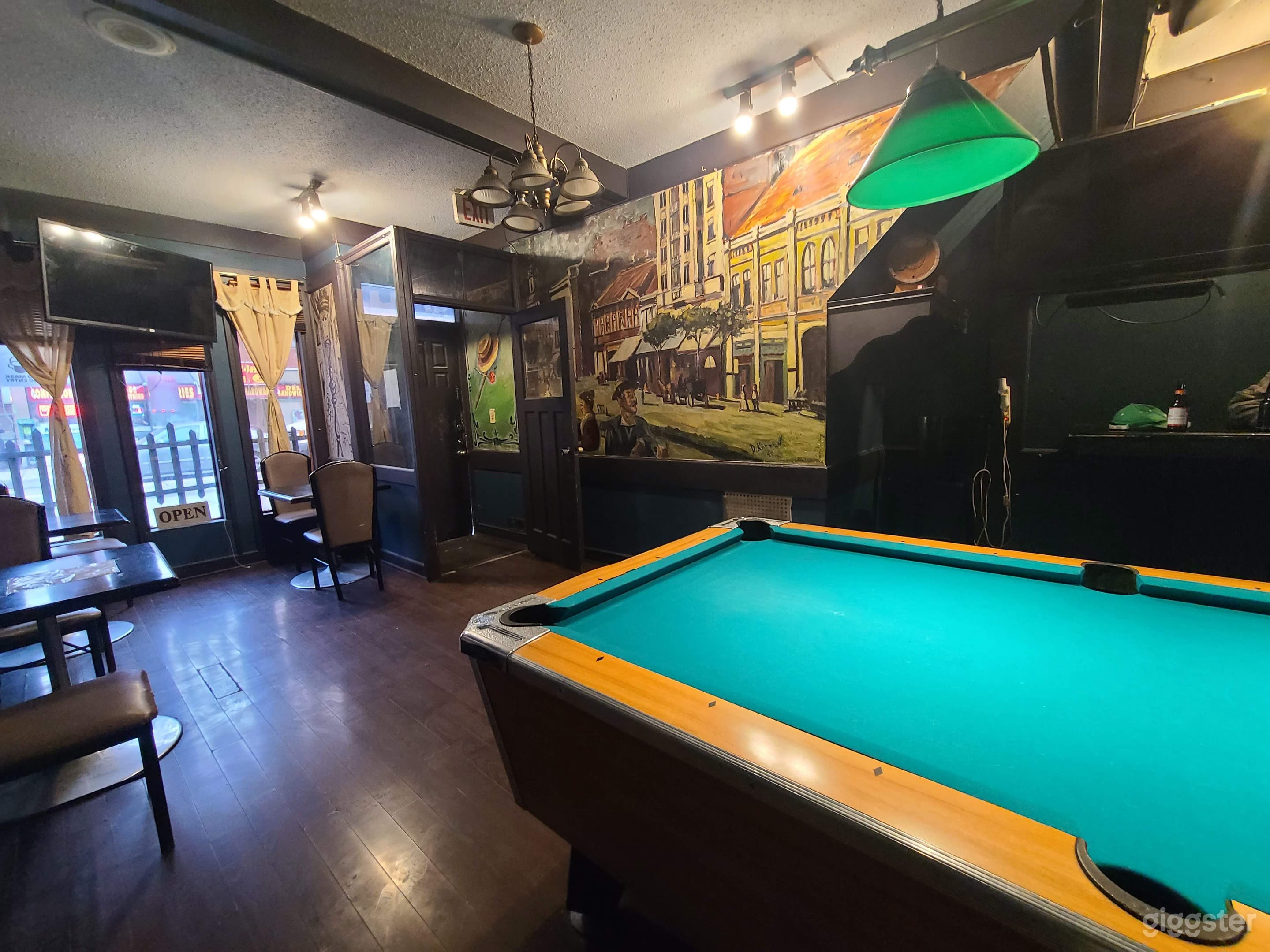 Pool table with Famous European Artist paintings on the wall 
