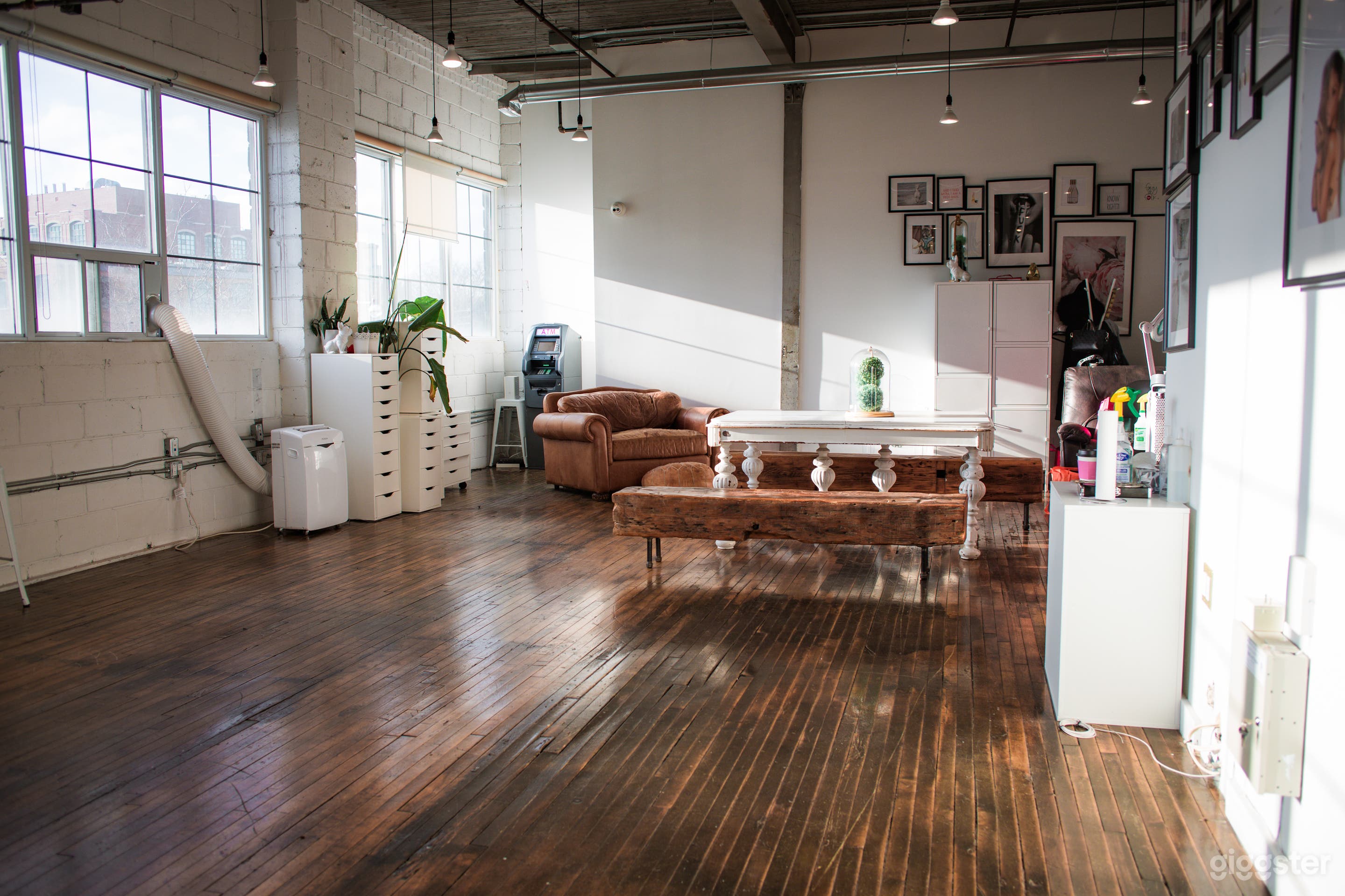 Natural light loft, exposed brick, industrial look, sunlight photography studio, golden hour 