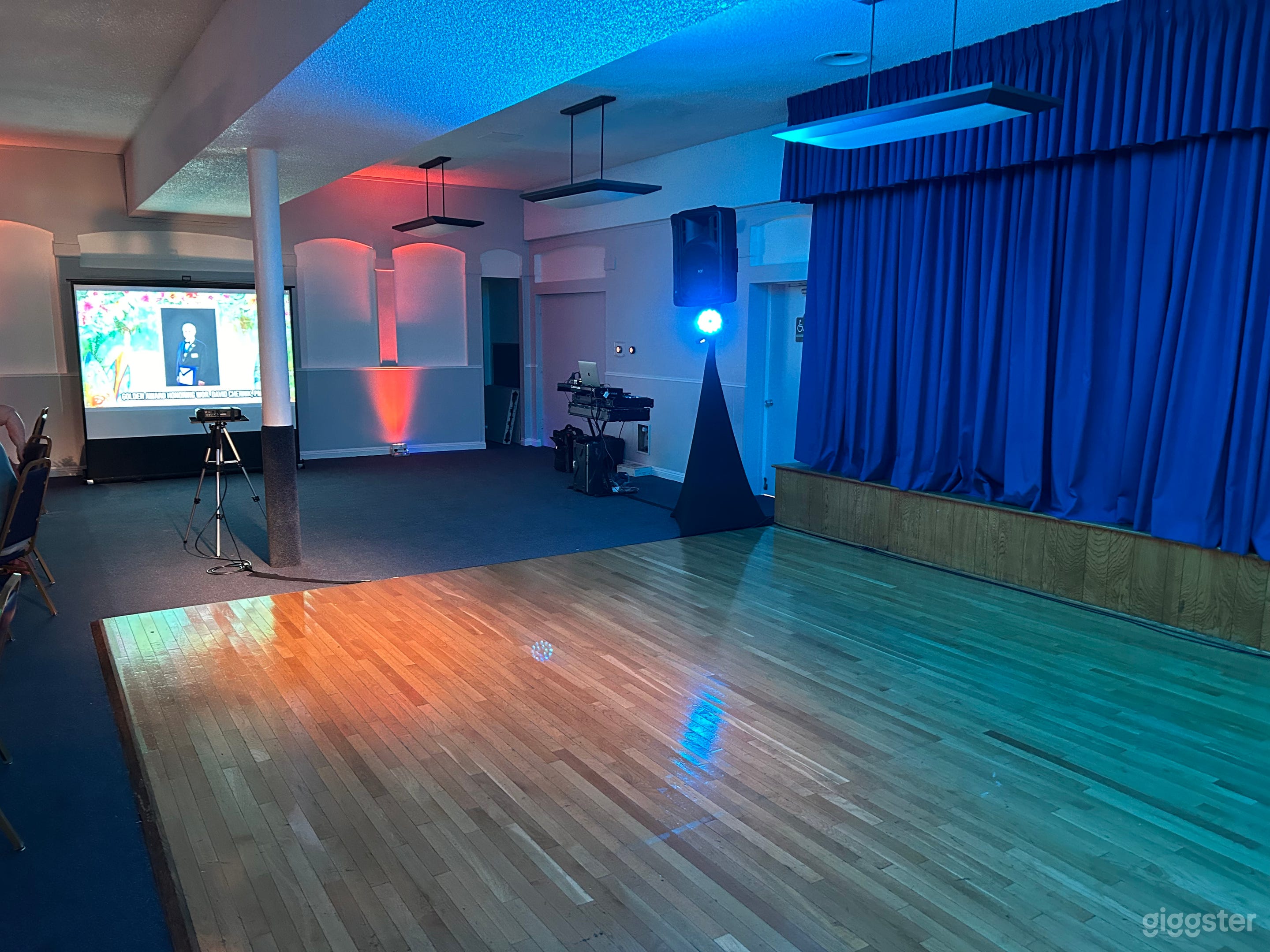 N/E facing view of the dance floor and stage perfect for a band or DJ to set up.