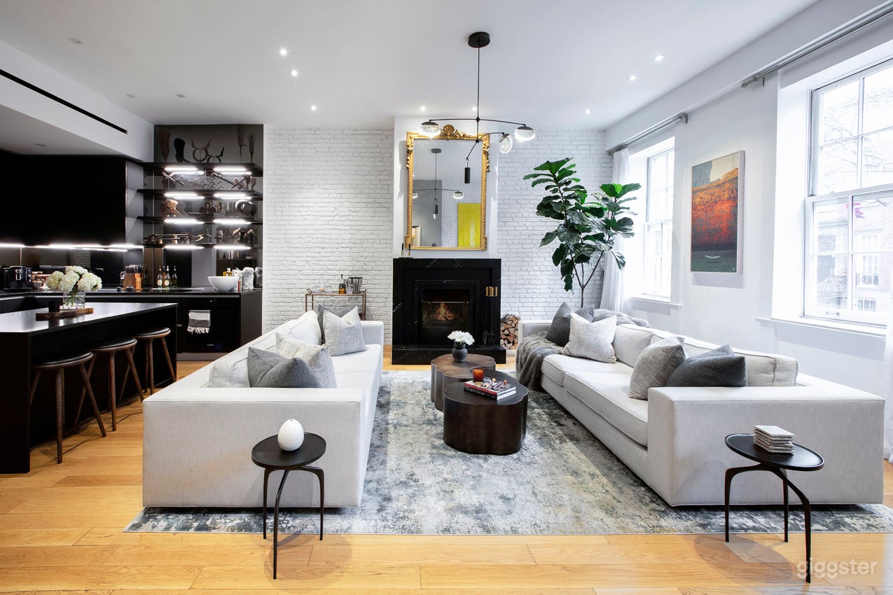 The living room is sun blessed with plenty of natural light and has a working fire place