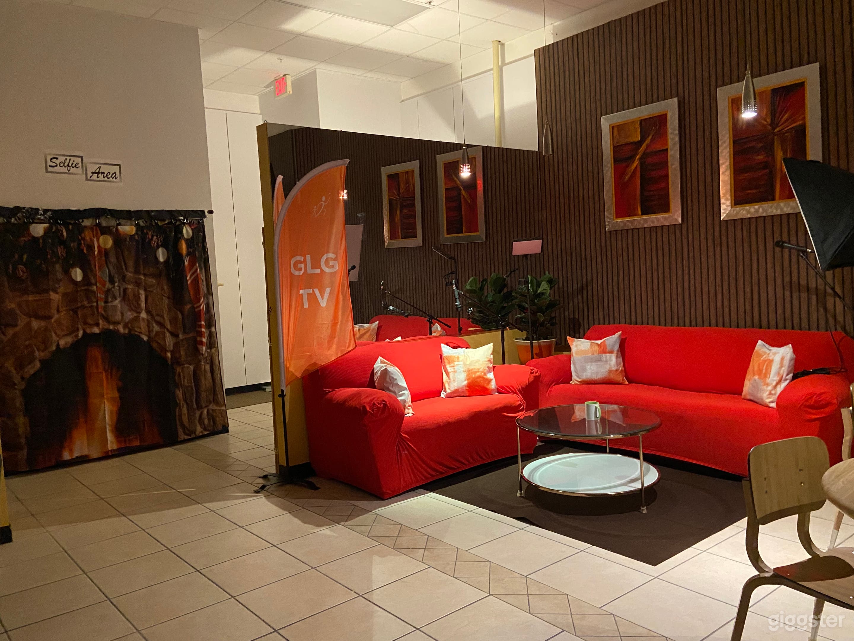 Whether it's a talk show, interview, or interactive content creation, this red couch becomes the vibrant backdrop for memorable moments and dynamic storytelling.