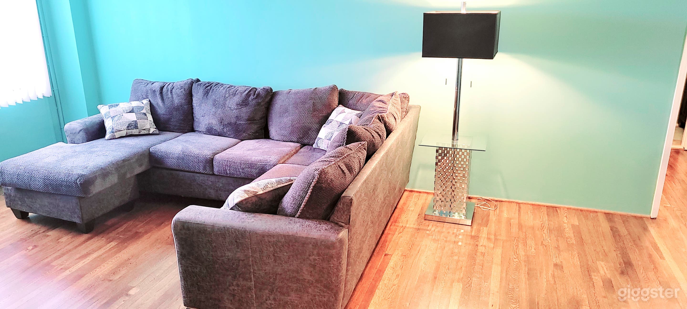 Living Room Area with natural light from triple window