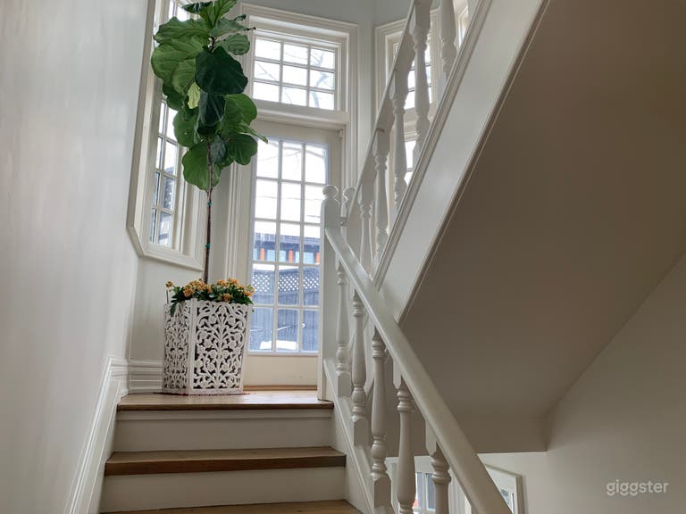  Light filled stairway with vaulted ceiling provides a sun-drench feeling to the home.  Walk out to tree top deck. 