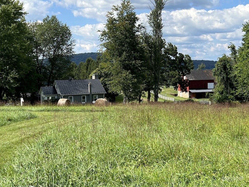 View of the barn from the Upper Meadow and actor Patrick Swayze's cottage in the foreground...