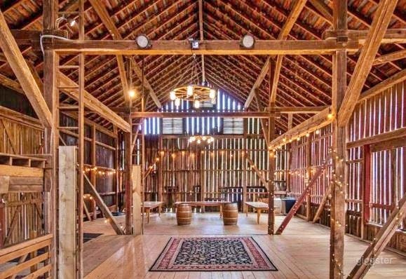 Interior of Event Barn, fully lighted 2 bathrooms, stage, and more!