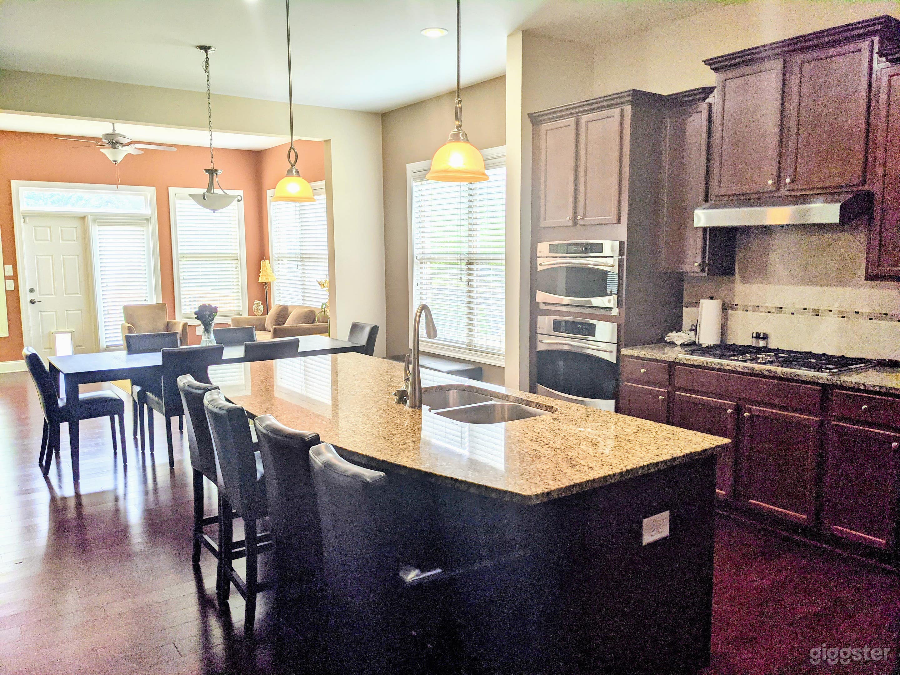 The kitchen opens to the breakfast area and sunroom