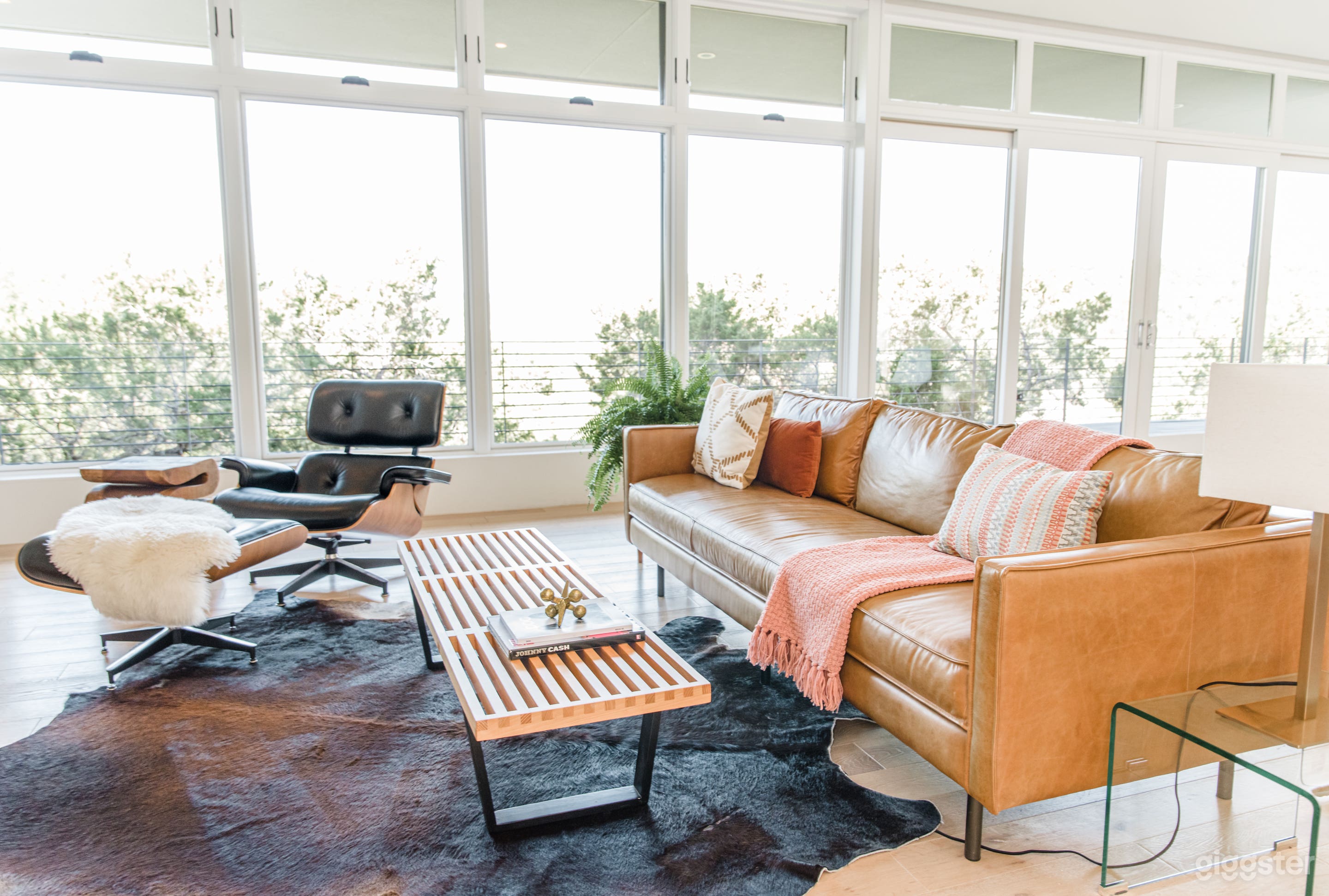 The living room is decorated in mid-century modern style.