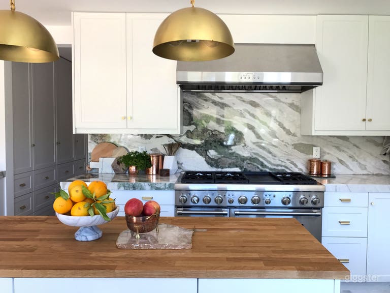  Kitchen island, green tweed marble backsplash, and brass fixtures. Excellent light from 3 directions
 