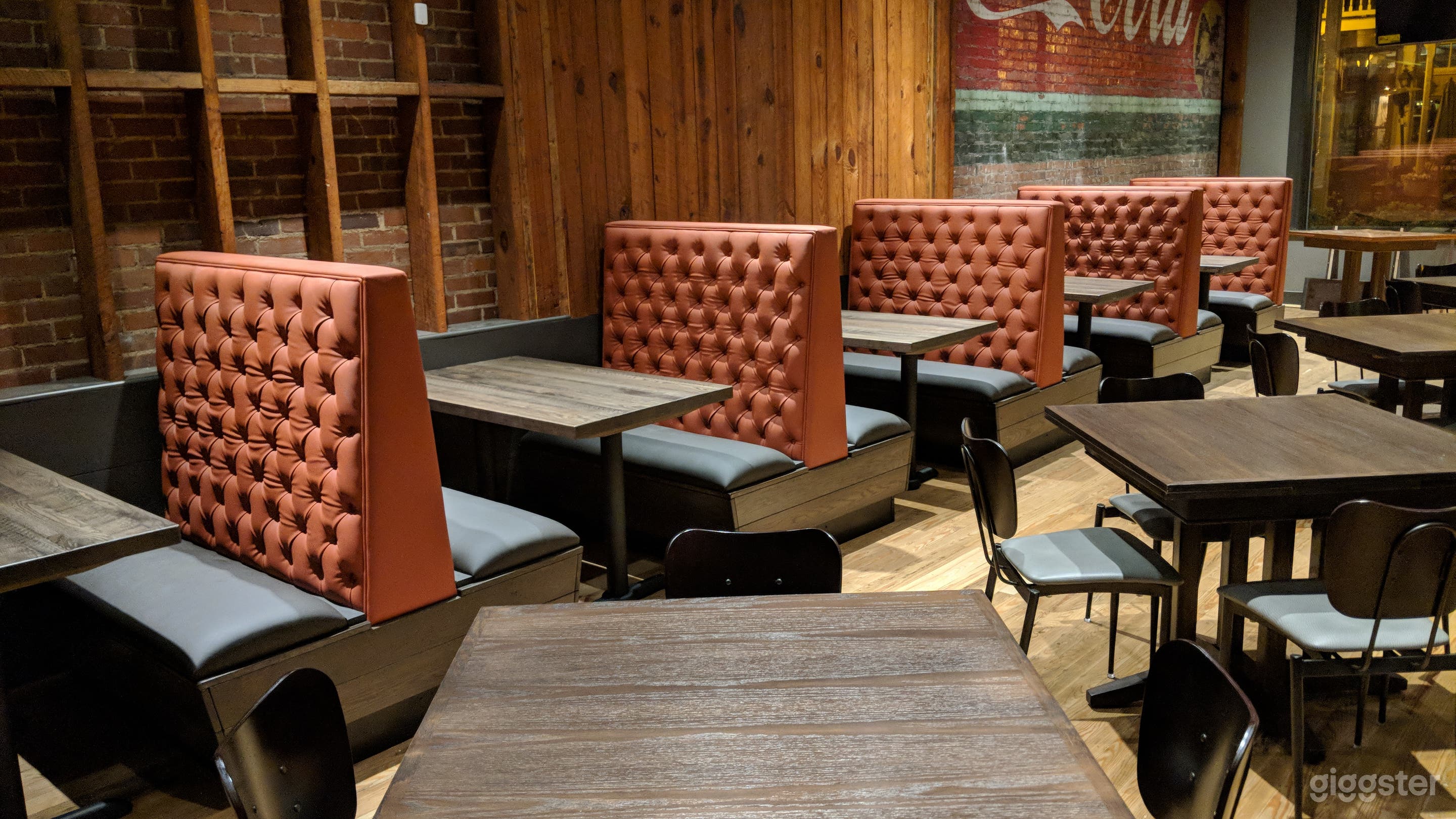 More seating, burnt orange accent color.