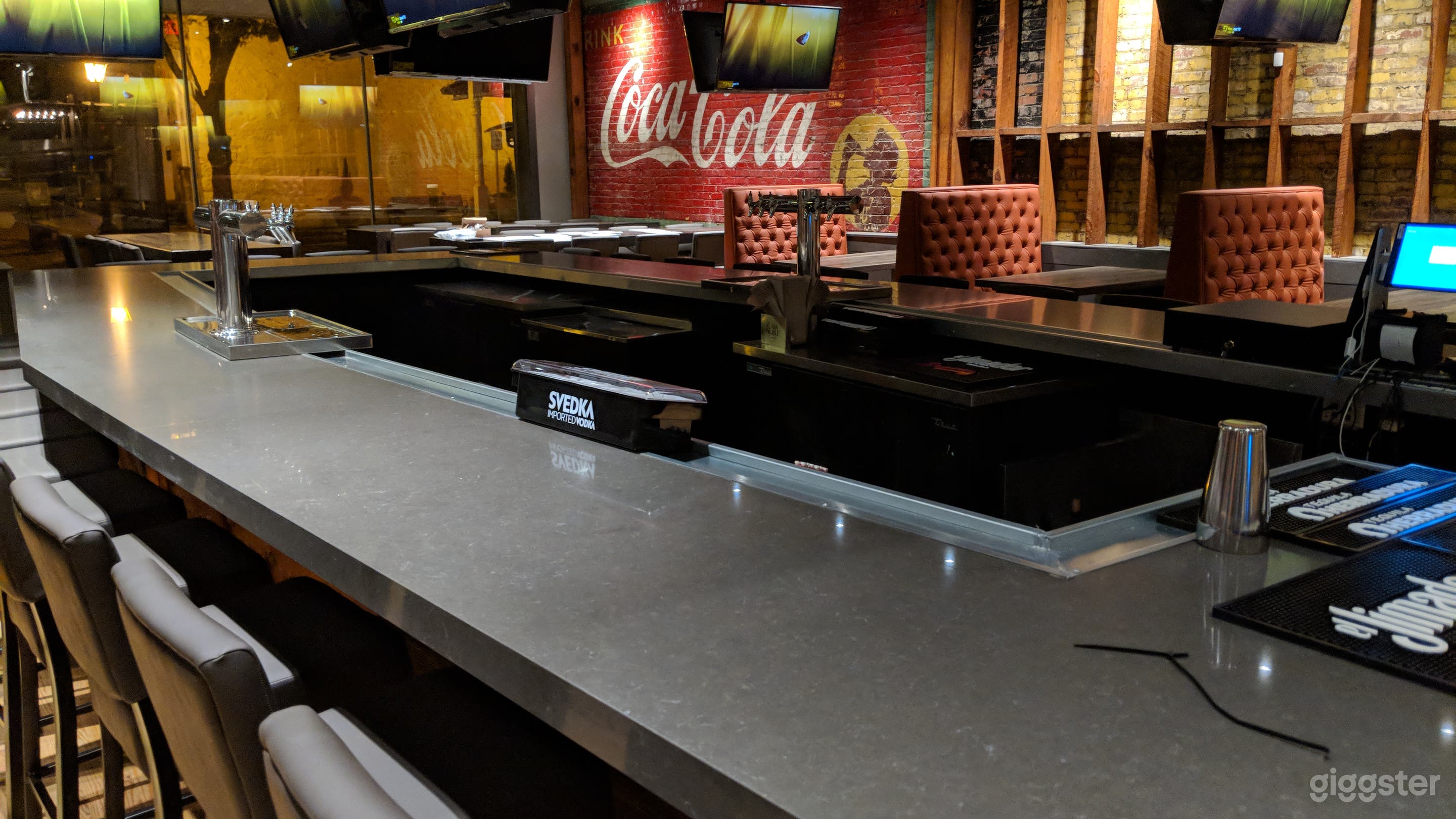 Another shot of the bar, large Coca-Cola mural in the background