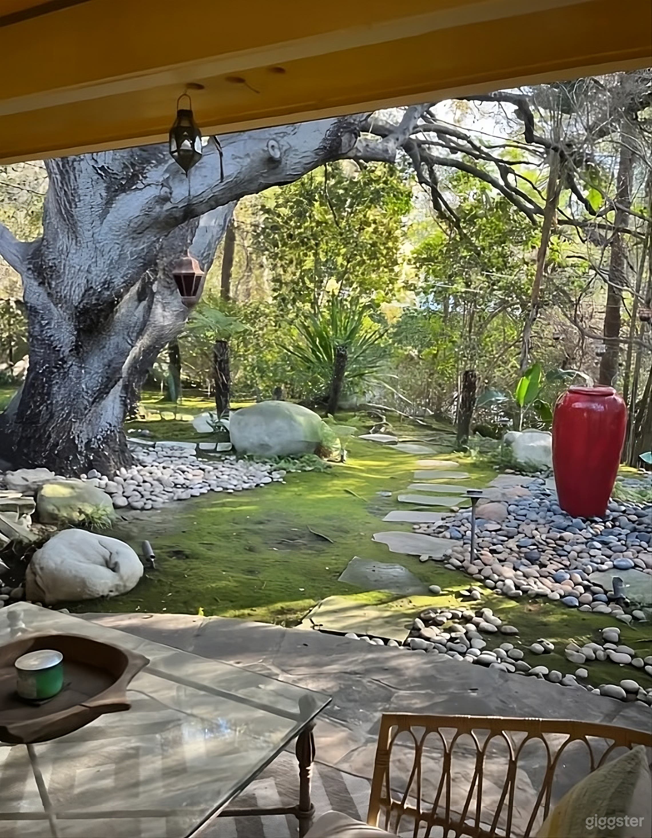 Enchanting Terraced Backyard with Stone Pool Photo 4