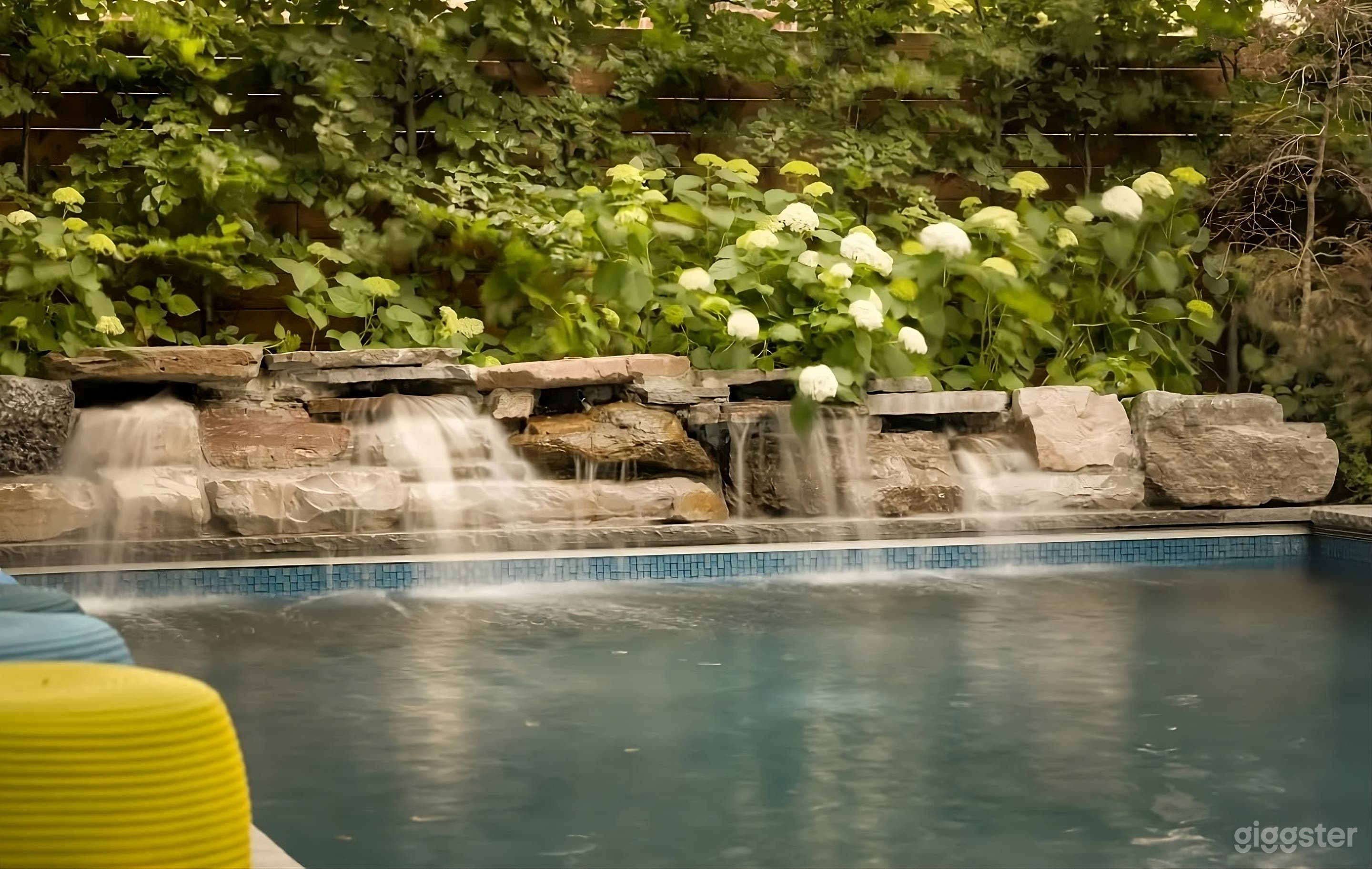 Secluded Backyard with Waterfall Pool Photo 4