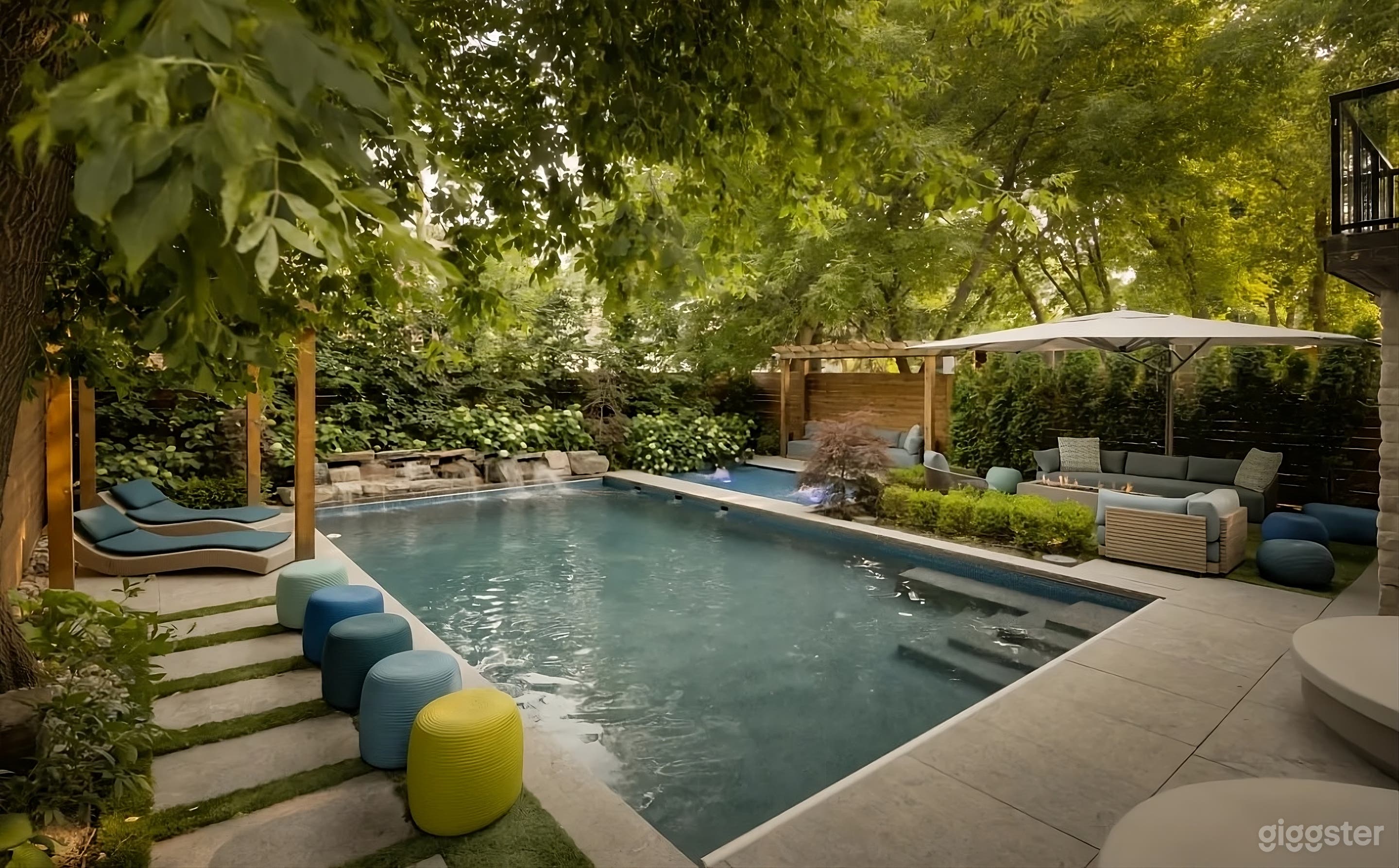 Secluded Backyard with Waterfall Pool Photo 3